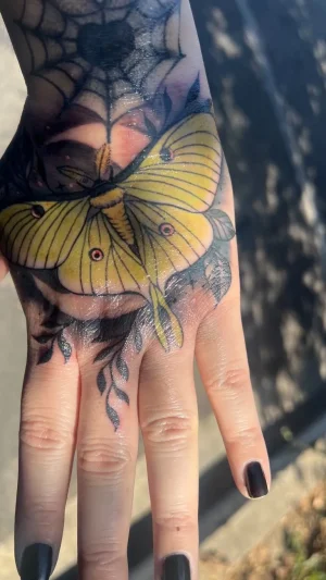 Yellow Moth Hand Tattoo