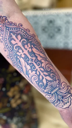 blue ornamental motif tattoo