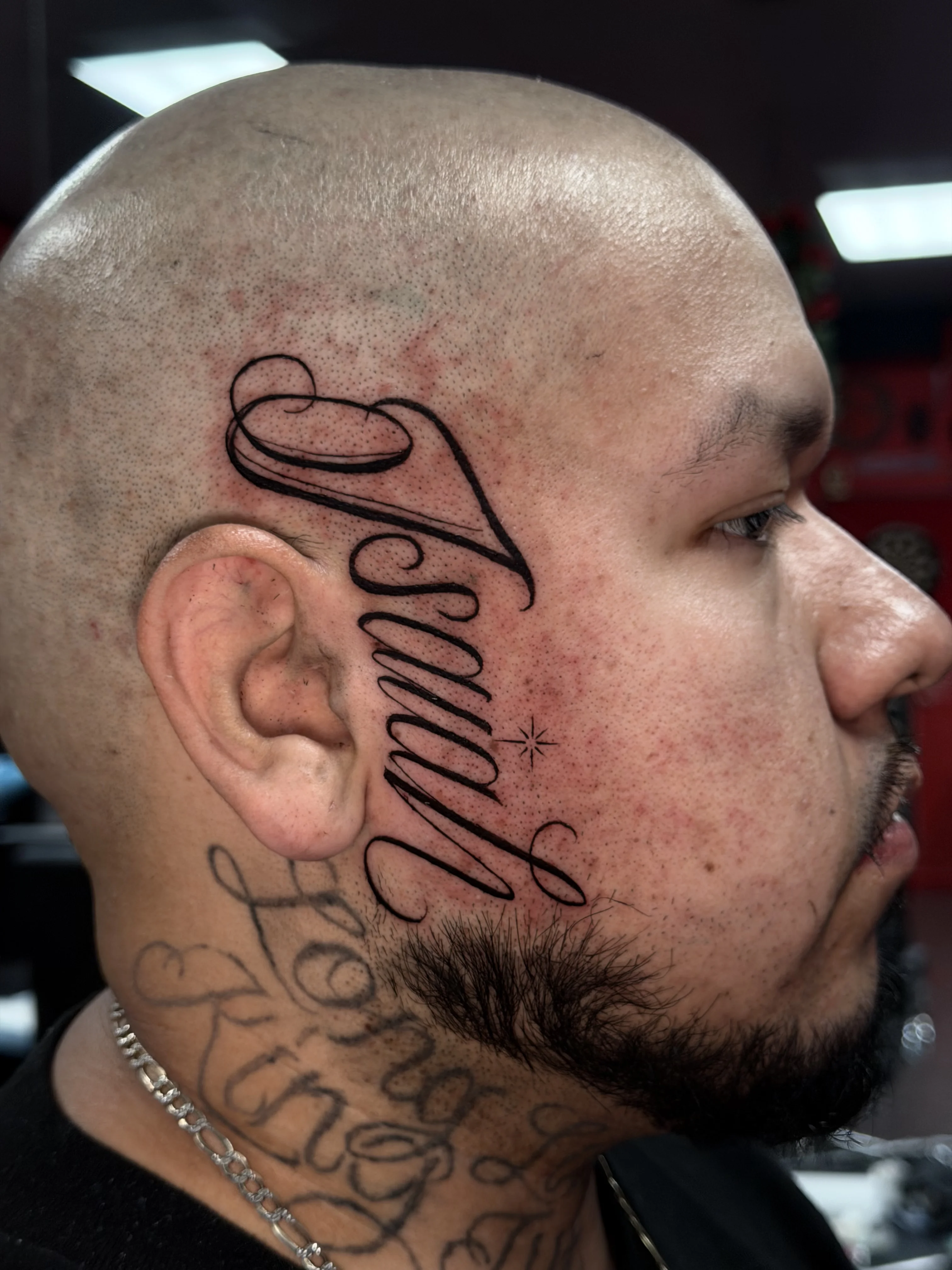Blackwork tattoo by Krybaby: script, lettering, bold, large