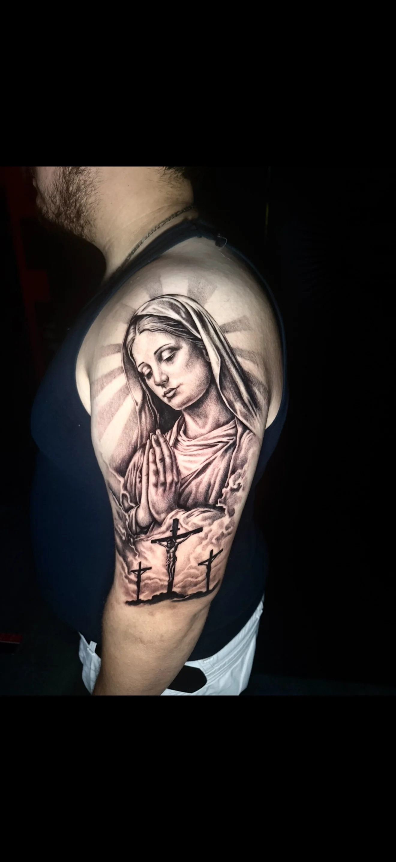 Black & Gray Realism tattoo by Bethany Villagomez: woman, praying hands, cross, clouds