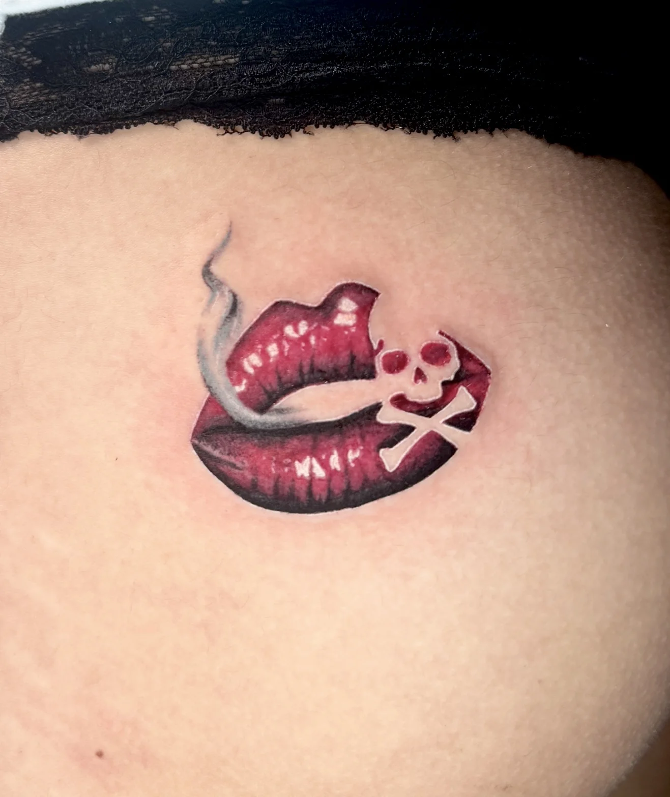 Color Realism tattoo by Bethany Villagomez: lips, smoke, skull, crossbones