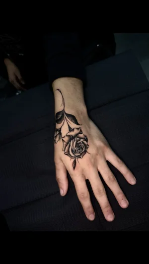 Realistic Rose Hand Tattoo