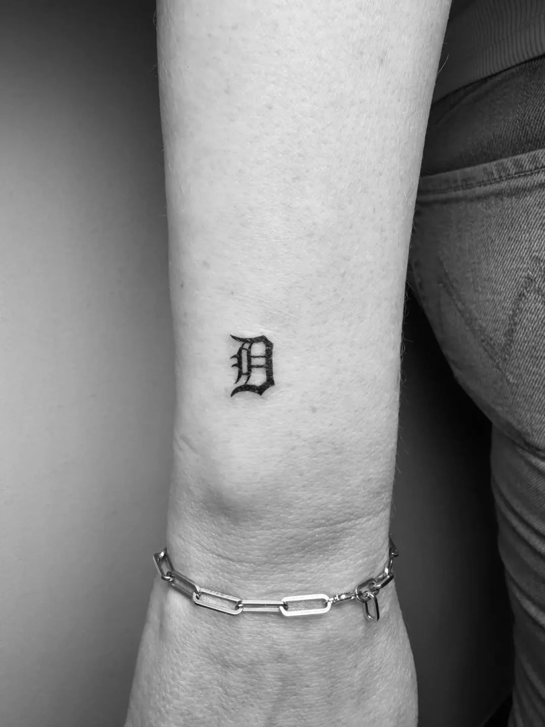 Blackwork tattoo by Daniel Winter: letter d, typography, minimal, lettering