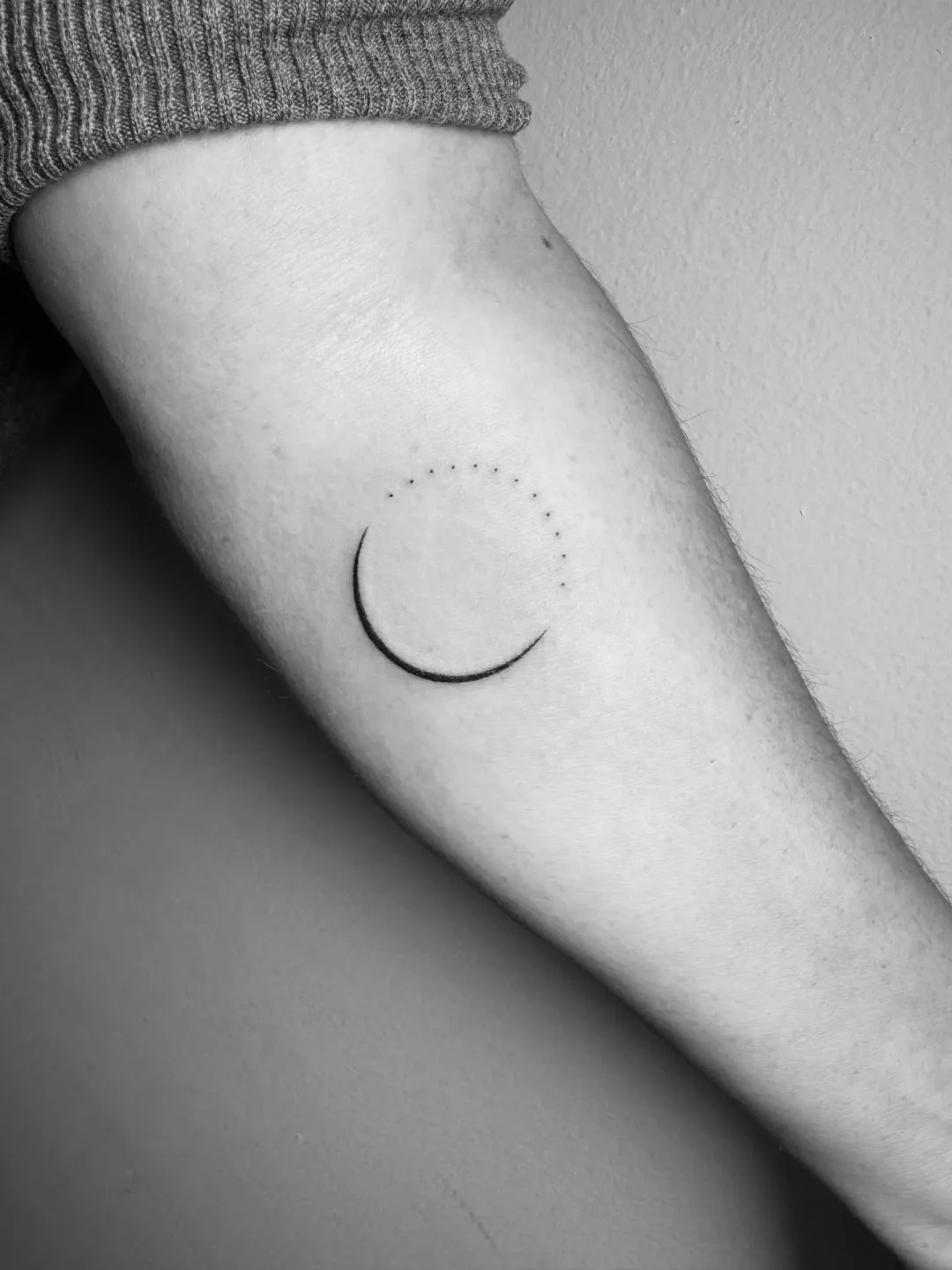 Fine Line tattoo by Daniel Winter: crescent moon, dotted circle, nature, minimalism