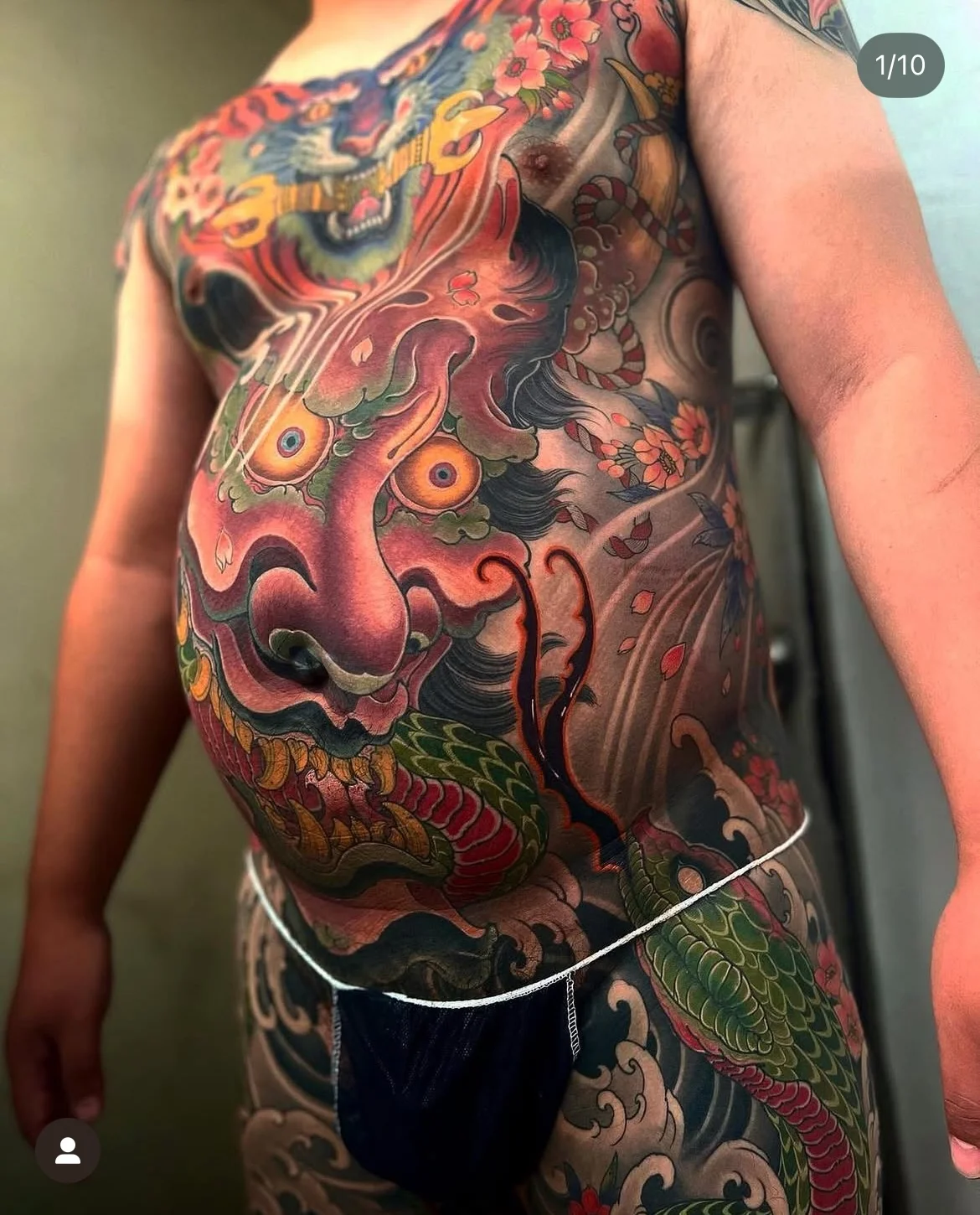 Japanese tattoo by Hocheon ART: dragon, flowers, scales, waves