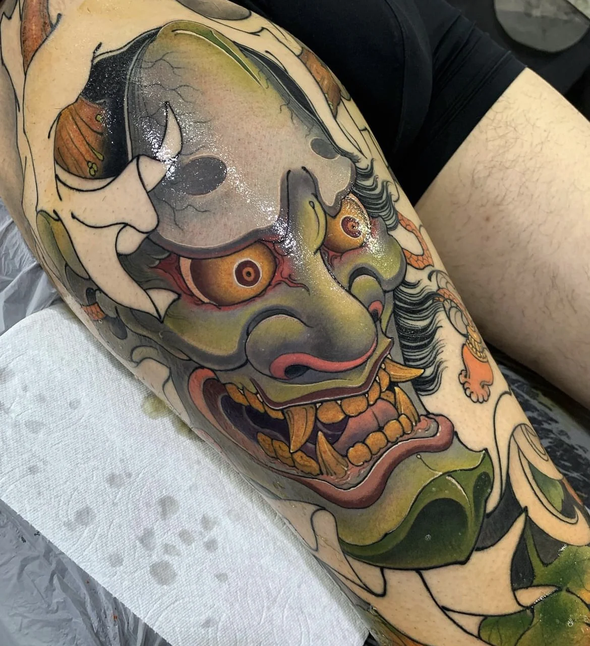 Japanese tattoo by Hocheon ART: demon mask, teeth, eyes, horns