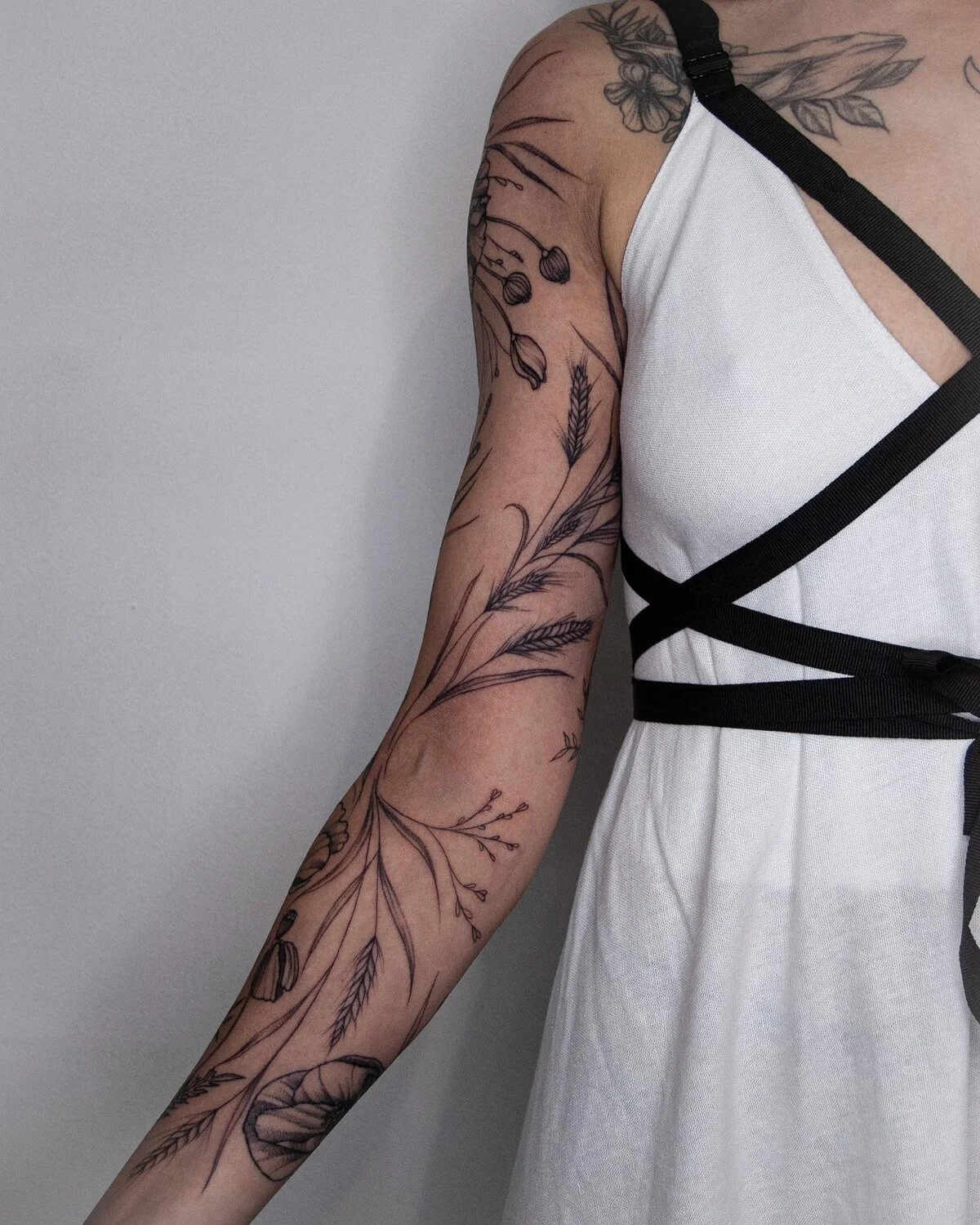 Fine Line tattoo by kisha.tattoo: poppy flower, poppy seed pod, wheat stalks, grasses