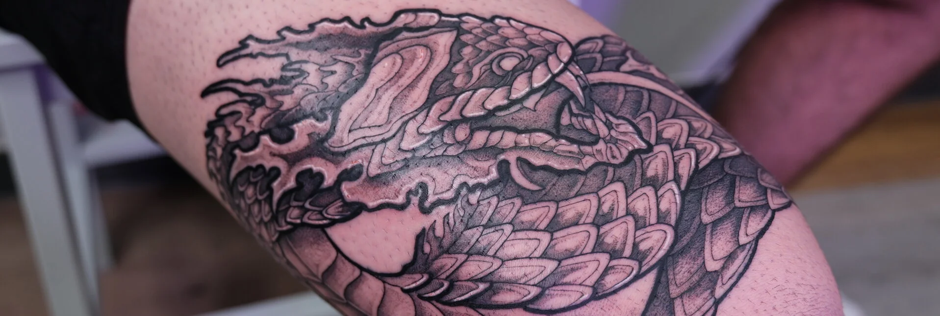 Black & Gray Realism tattoo by kisha.tattoo: snake, scales, fire, tongue
