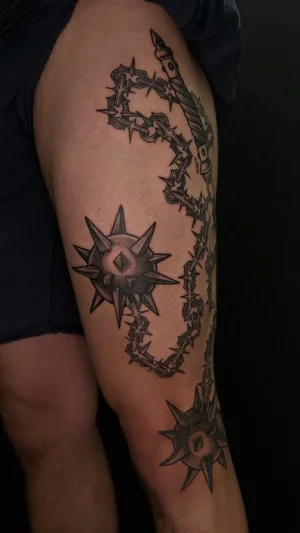 Blackwork Sun & Chain Arm Tattoo