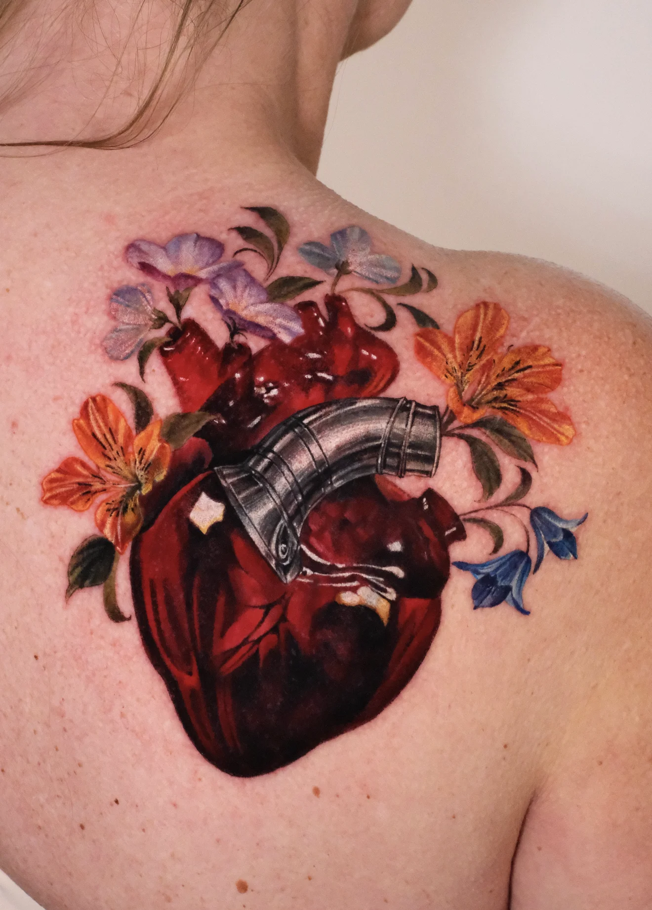 Color Realism tattoo by Valeriatattooing: heart, flowers, leaves, armor plate
