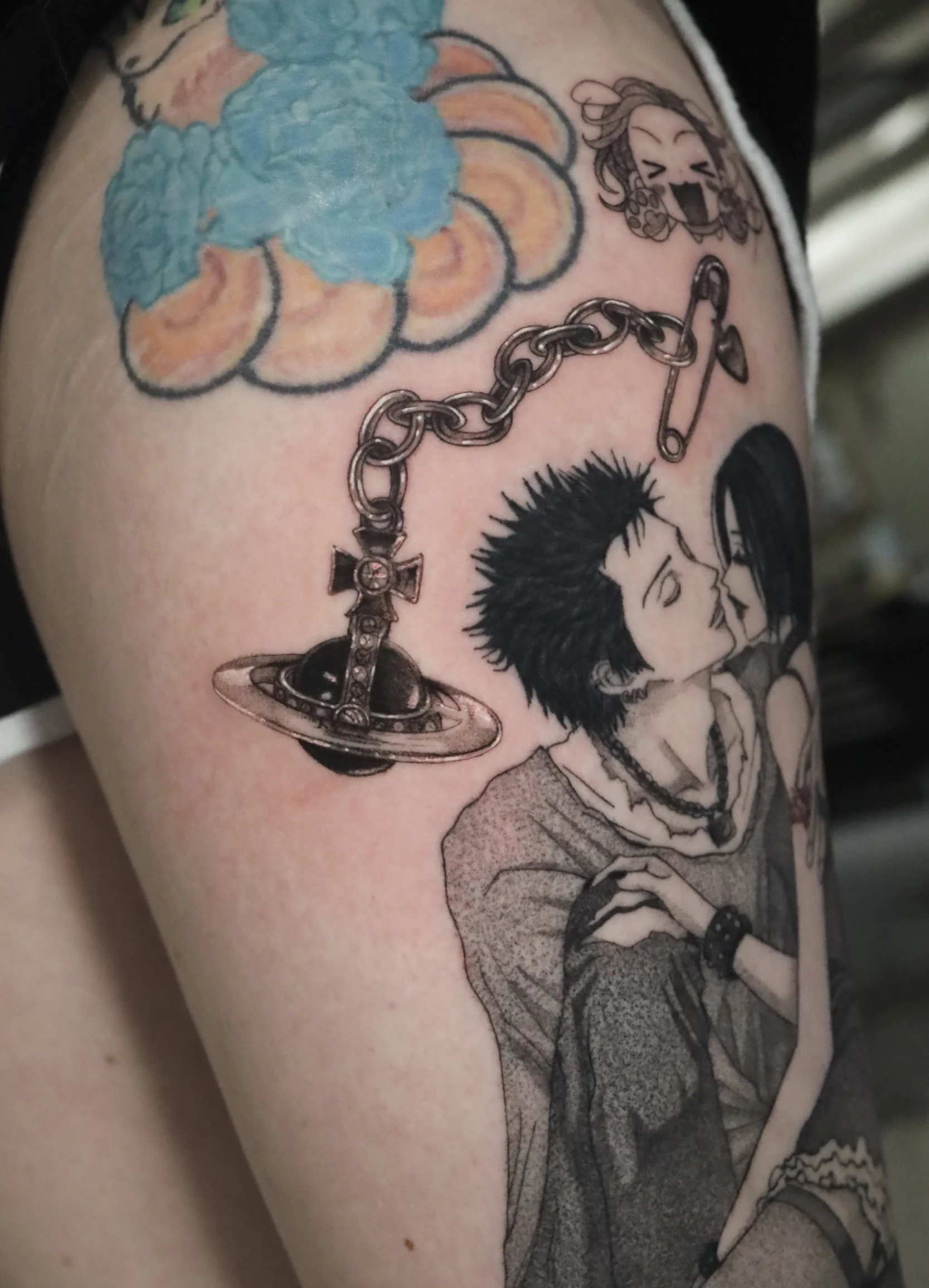 Anime tattoo by Dana Nicole: chain, black and grey, fineline, vivienne westwood