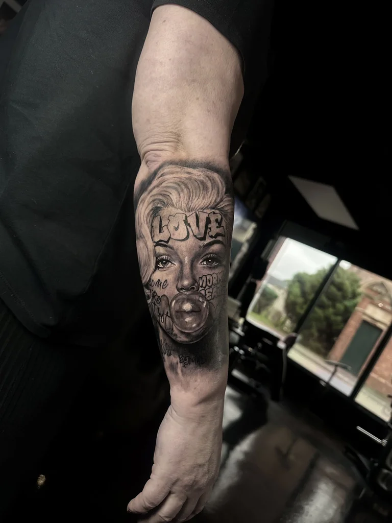 Realistic Woman Face Forearm: woman, face, bubble gum, text, hair, realism