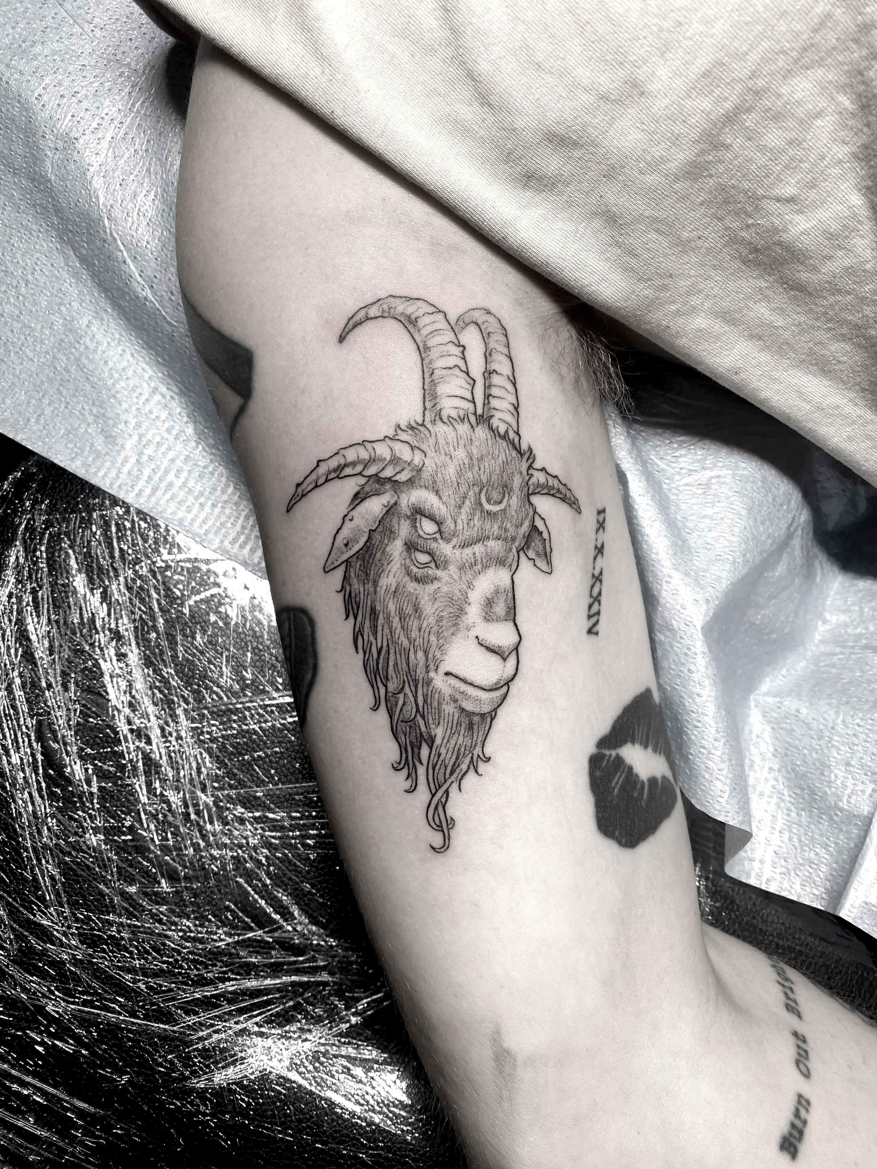 Black & Gray Realism tattoo by Wolfhound Tattoo: goat head, horns, moon symbol, animal