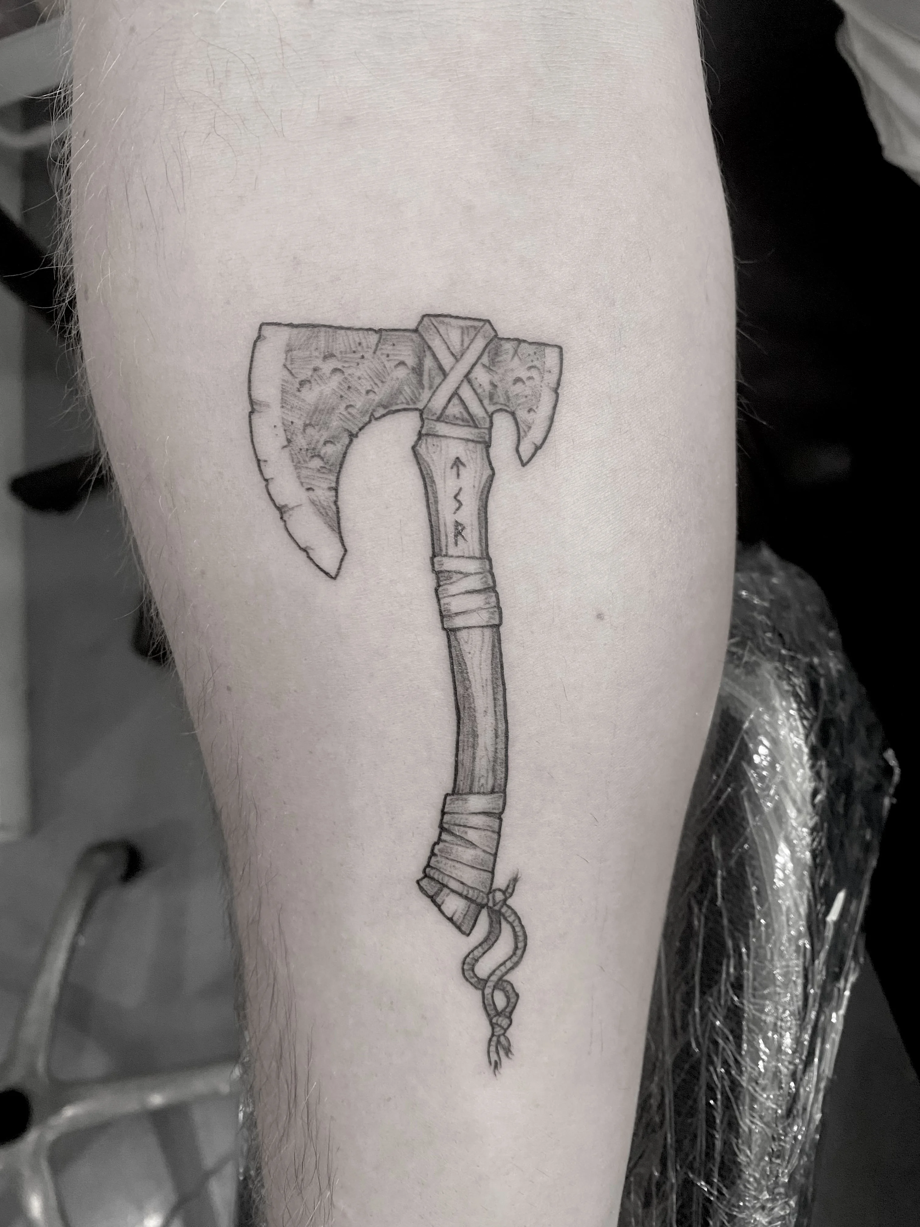 Fine Line tattoo by Wolfhound Tattoo: axe, handle, runes, wood