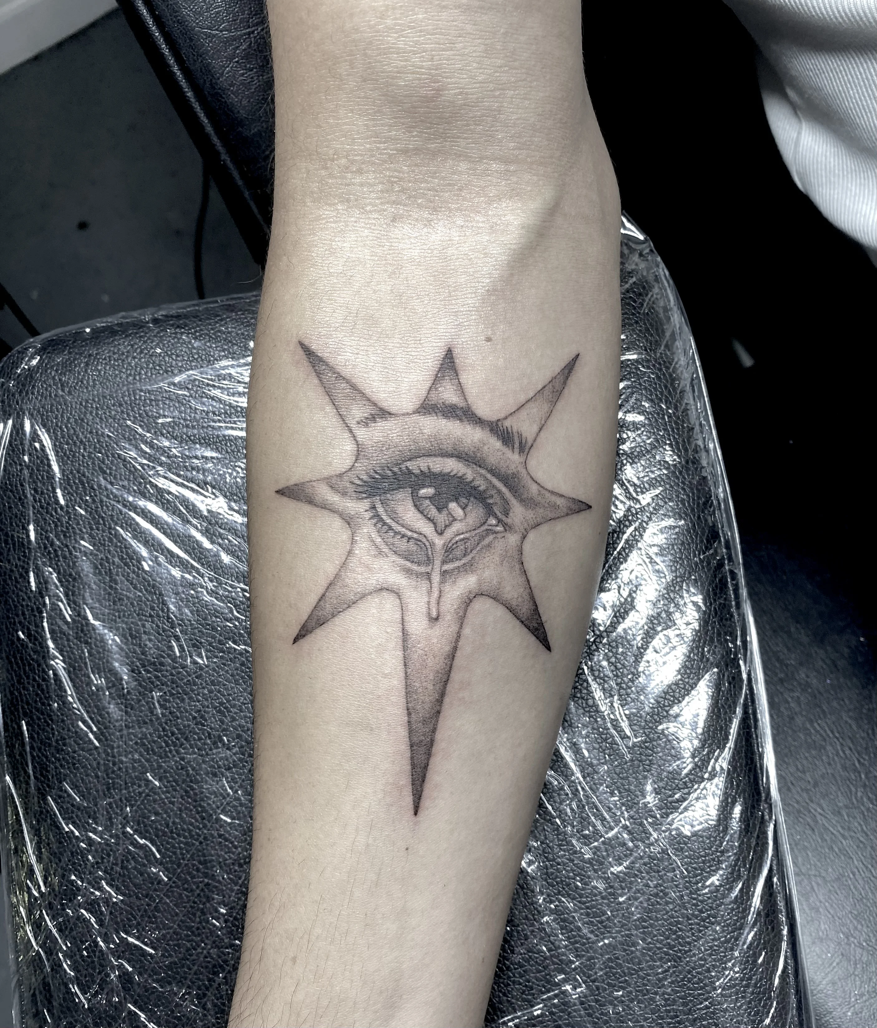 Black & Gray Realism tattoo by Wolfhound Tattoo: eye, star, tear, surrealism
