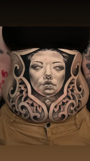Ornamental Woman Face Stomach Piece