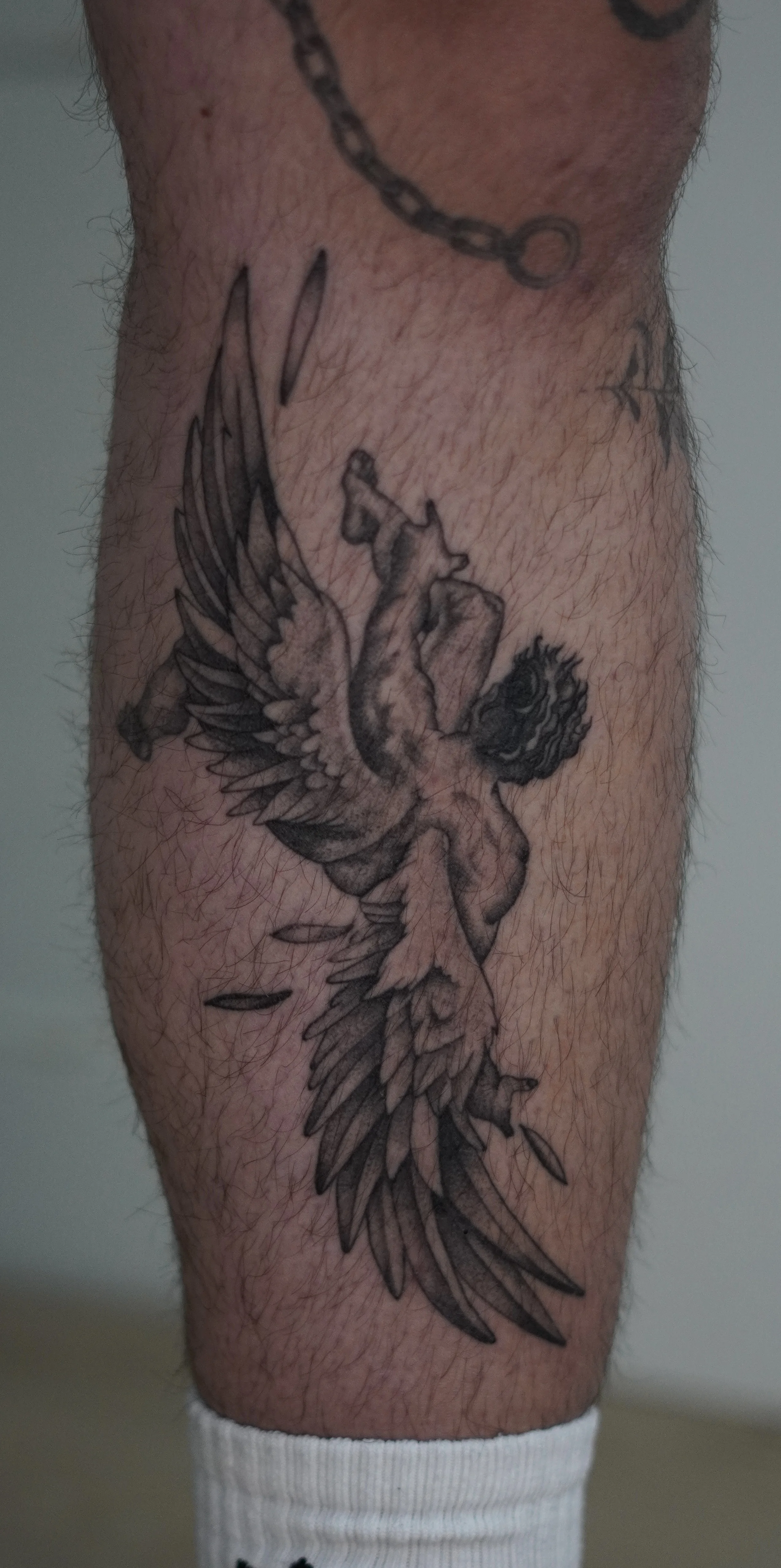 Black & Gray Realism tattoo by Kobe Virgen: fallen angel, wings, feathers, man