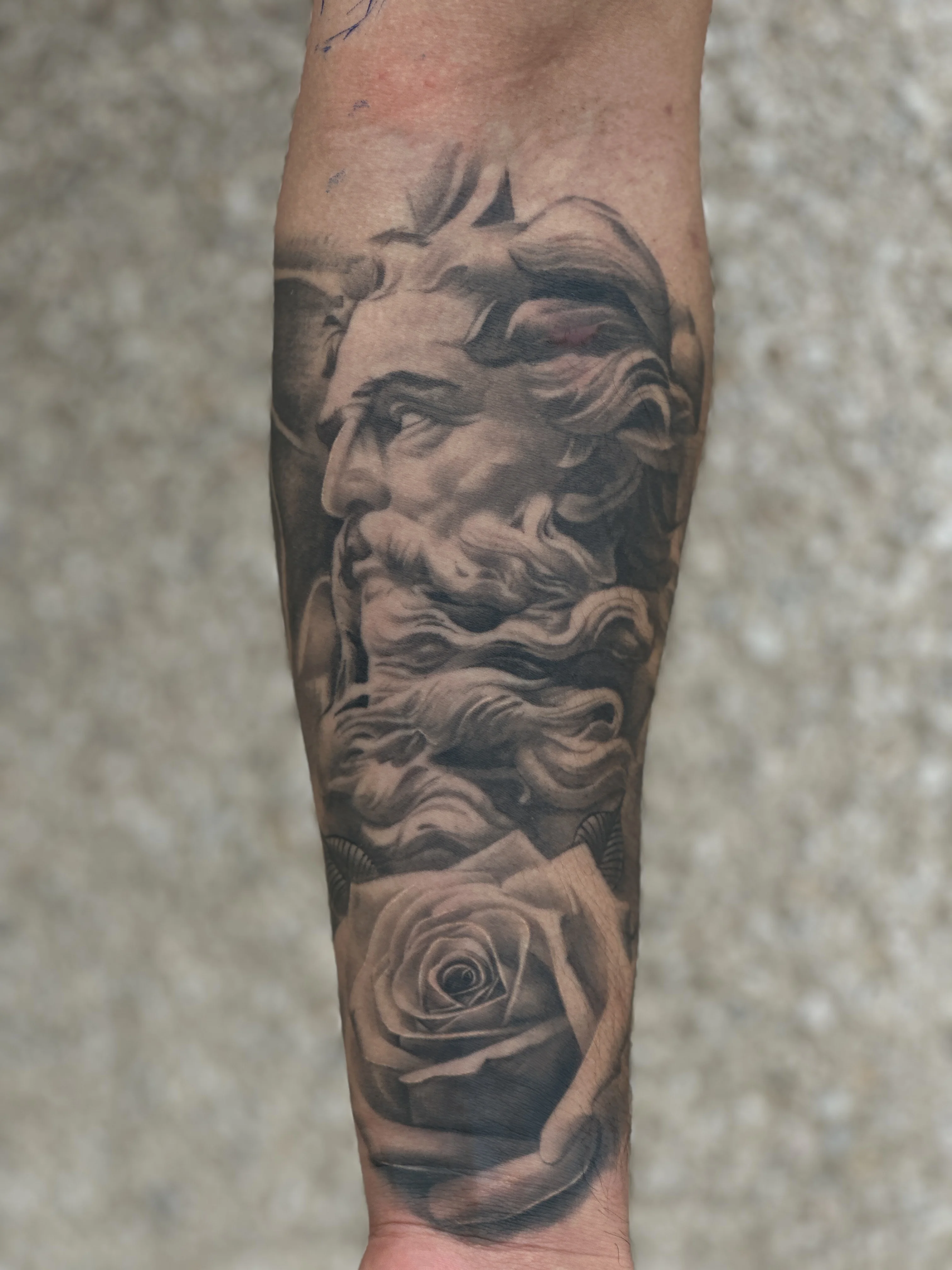 Black & Gray Realism tattoo by EL TAKAS: bearded man head, rose, mythology, floral