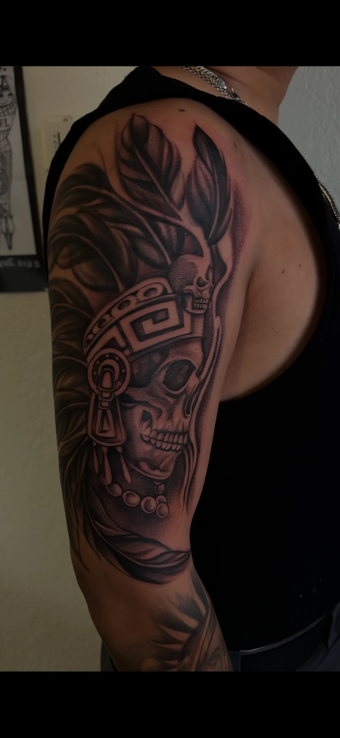 Black & Gray Realism tattoo by EL TAKAS: skull, feathers, headdress, beads