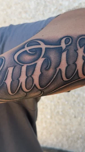 Bold Lucio Script Forearm