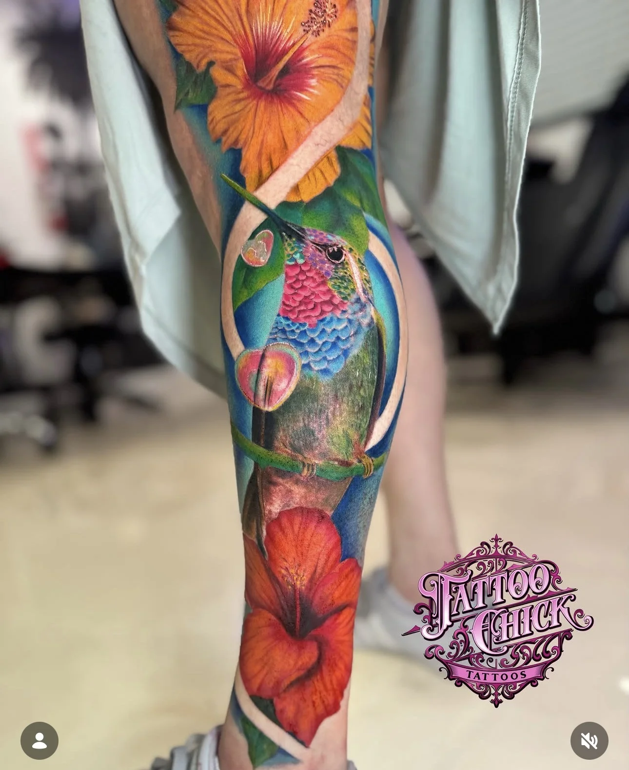 Color Realism tattoo by Tattoo Chick: hummingbird, hibiscus flower, leaves, branch