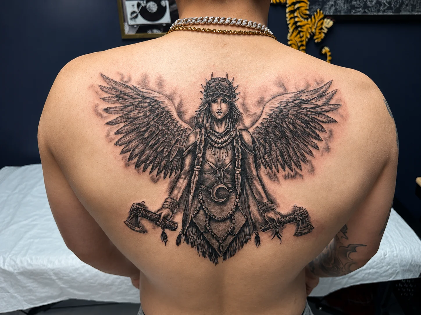 Winged Woman Warrior Back Piece: winged woman, axes, crown of thorns, beads, crescent moon, mythology