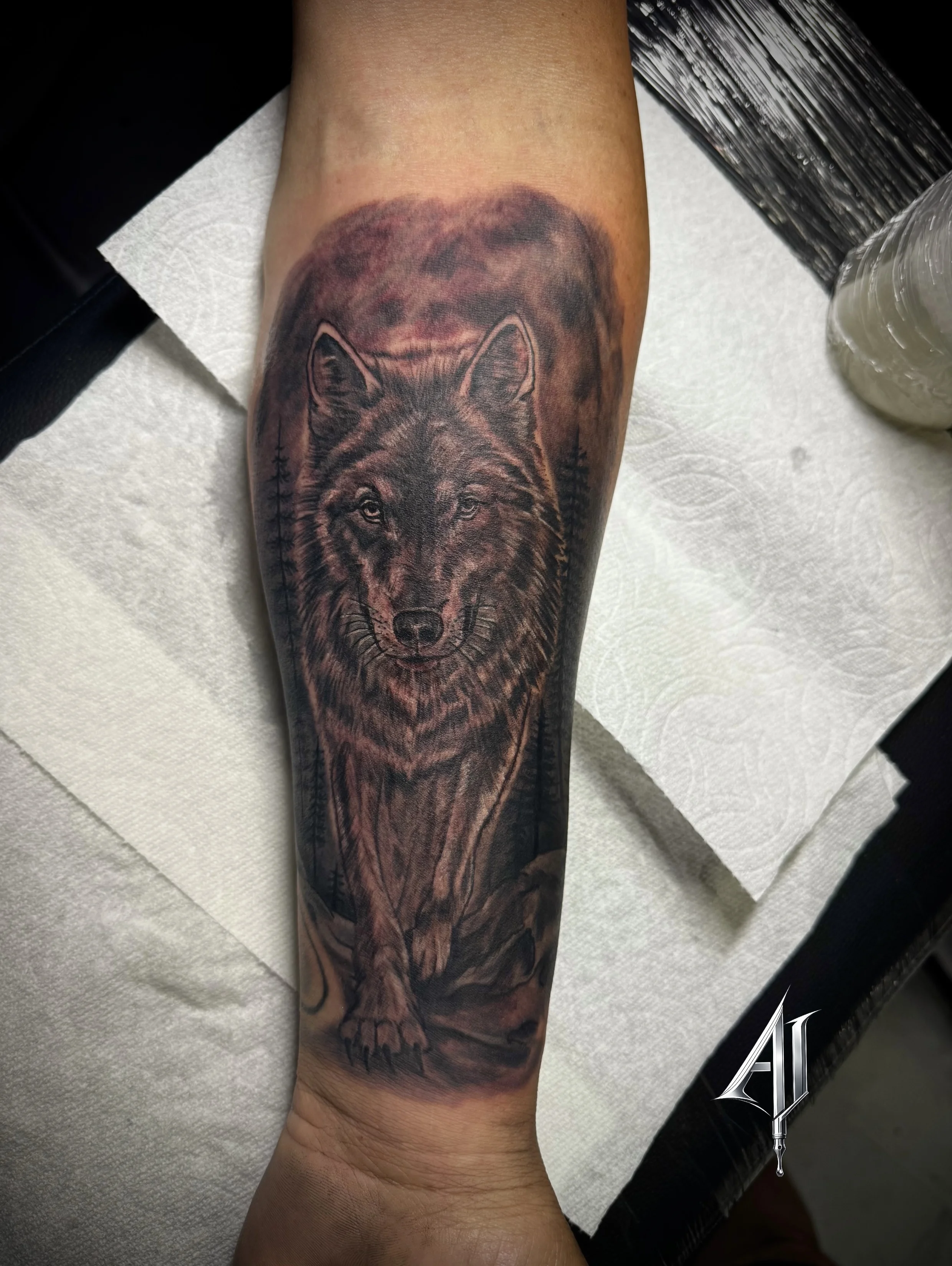 Black & Gray Realism tattoo by Andrei Ilin: wolf, trees, moon, rocks