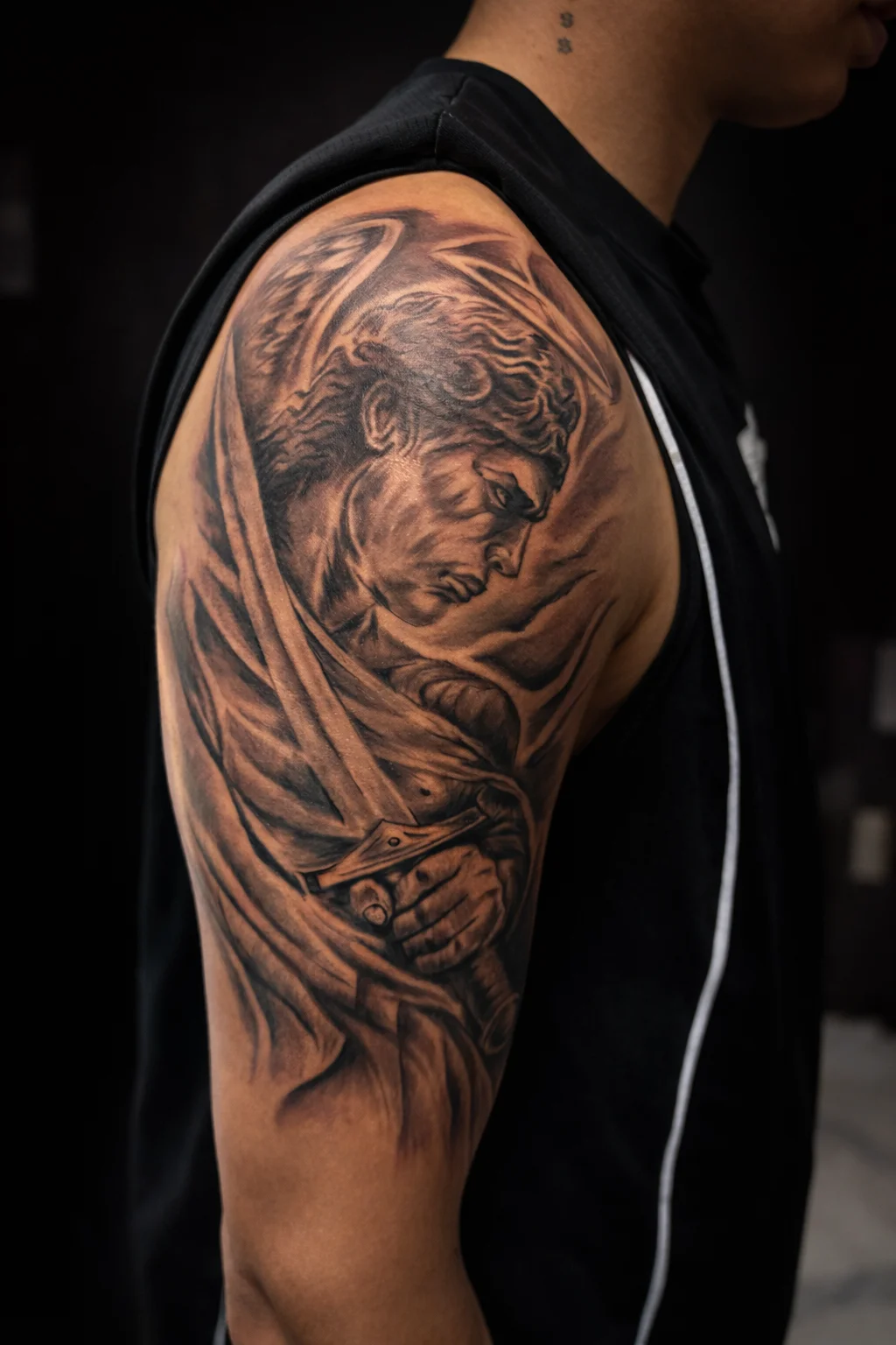 Black & Gray Realism tattoo by Andrei Ilin: angel, wings, sword, cape
