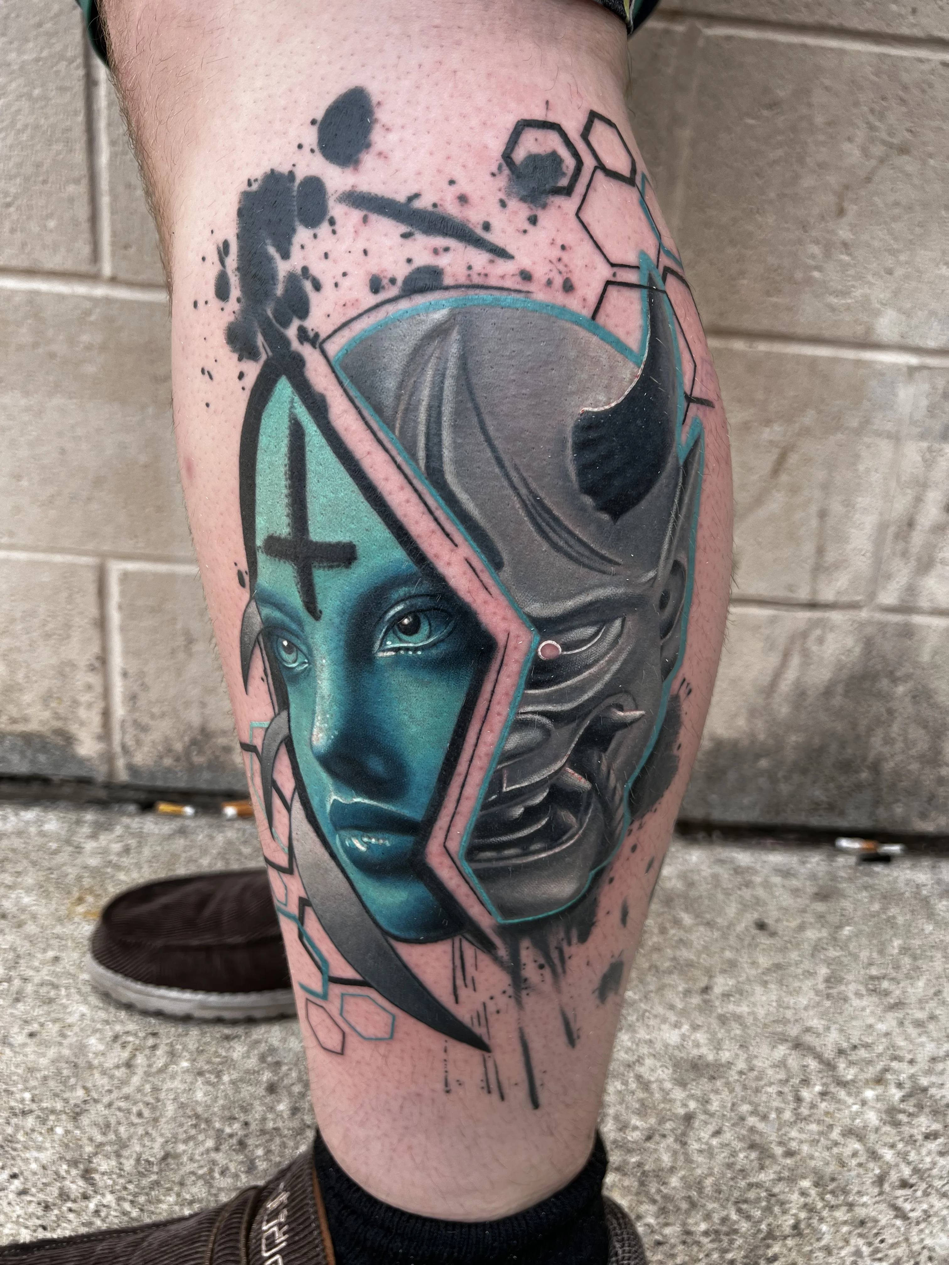 Color Realism tattoo by Joshua Gallant: woman face, mask, horn, cross