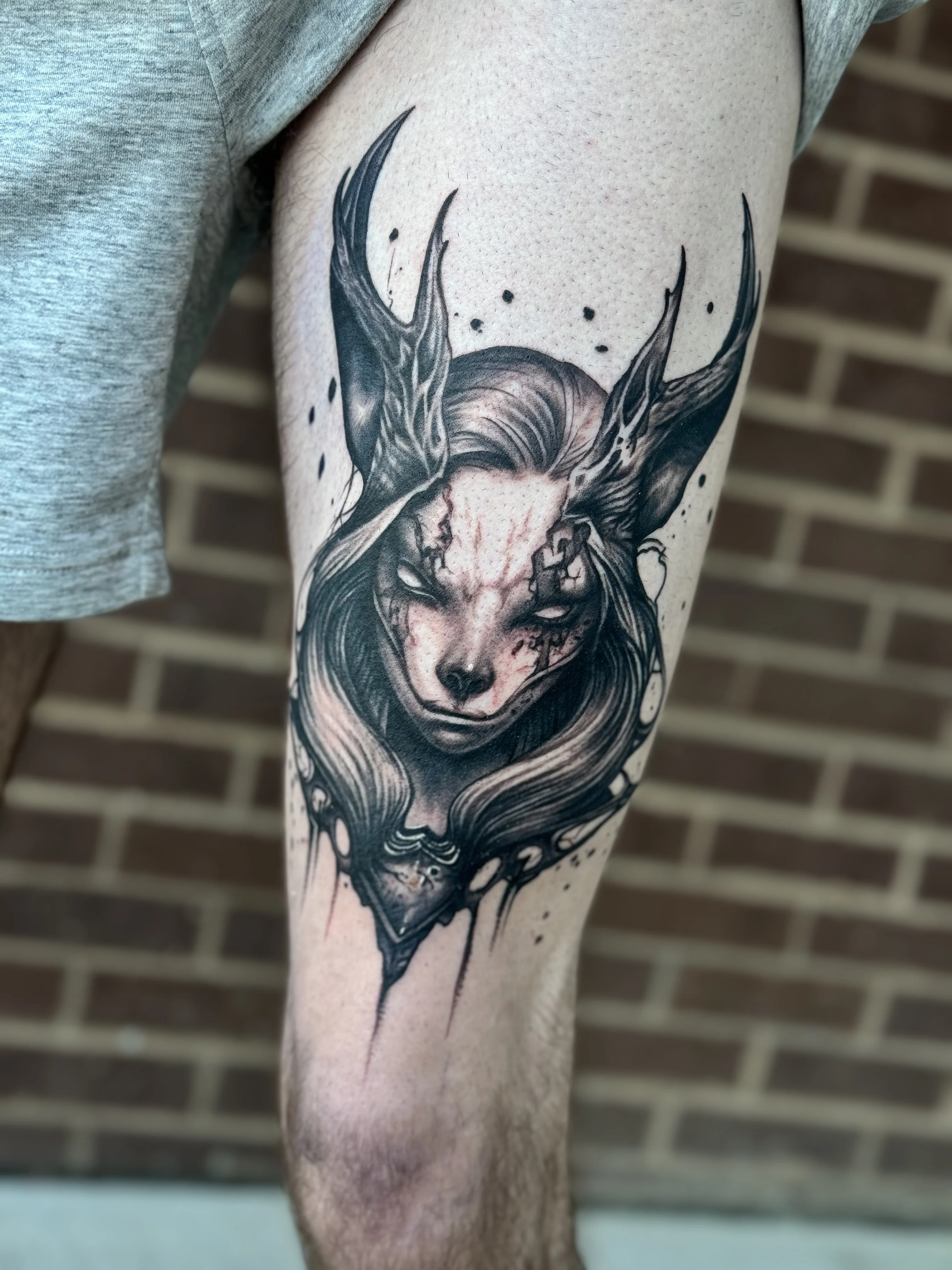 Black & Gray Realism tattoo by Joshua Gallant: fantasy creature, antlers, human hair, face