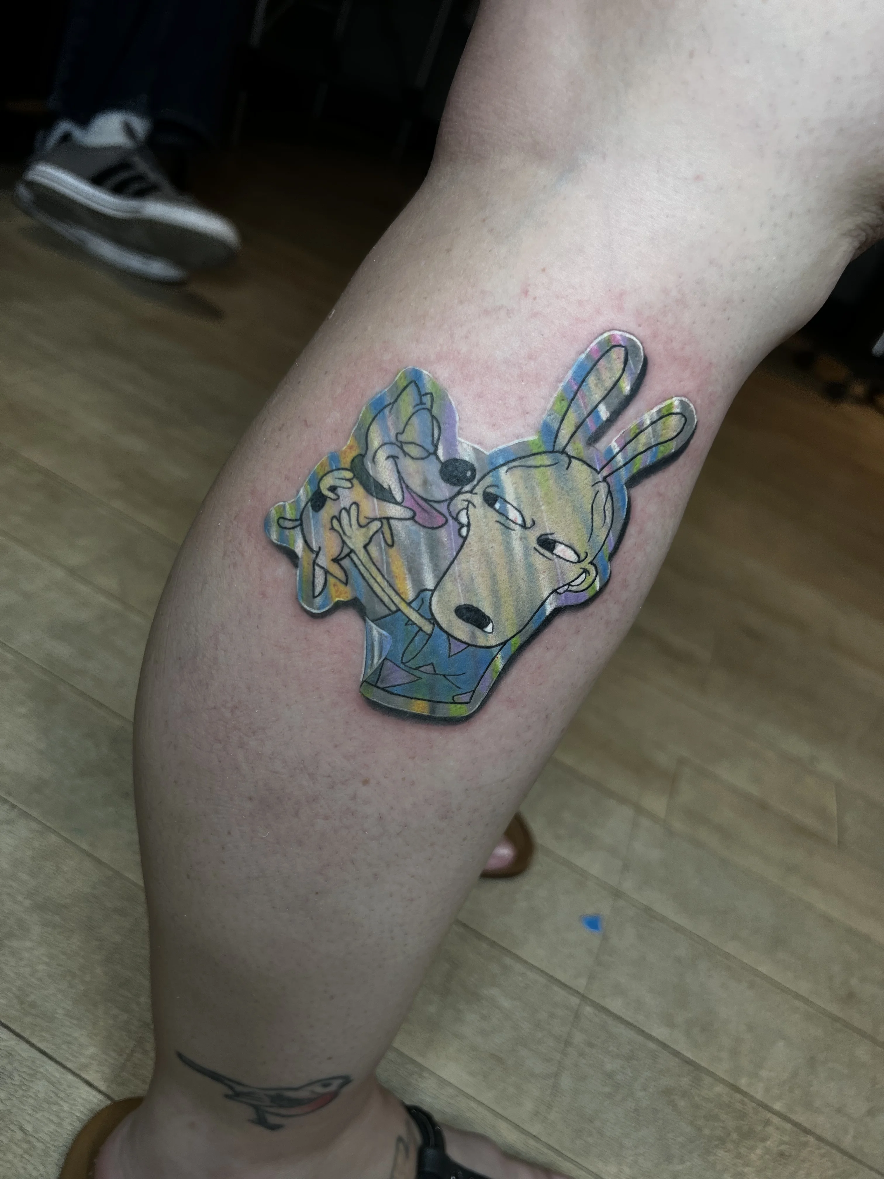 New School tattoo by Joshua Gallant: dog, rabbit, tongue, hand