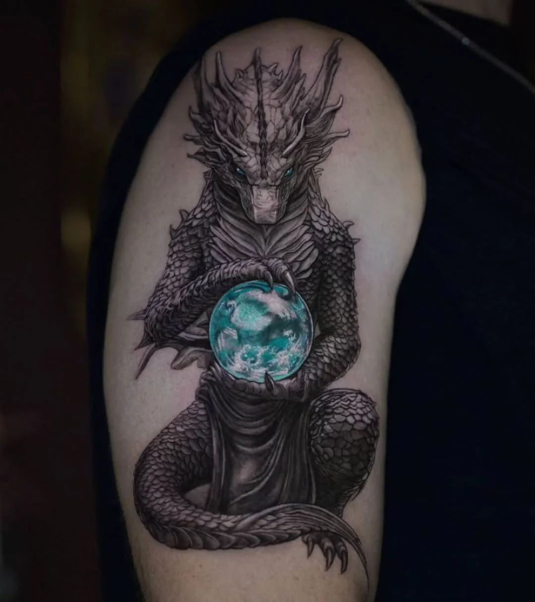 Black & Gray Realism tattoo by Stefano Alcantara: dragon, orb, scales, claws