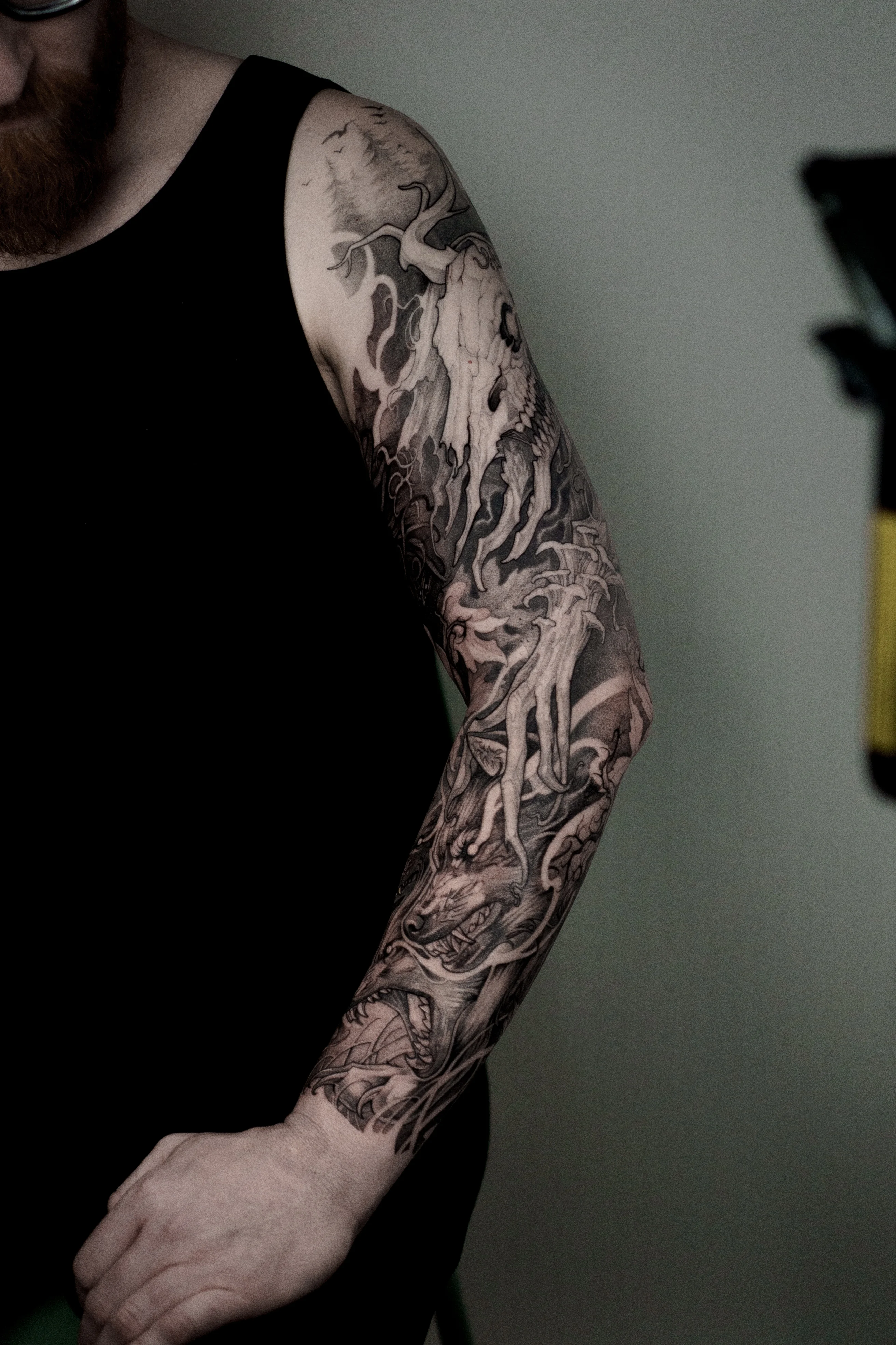 Black & Gray Realism tattoo by Olga Leonova: skull, tree, hand, bird