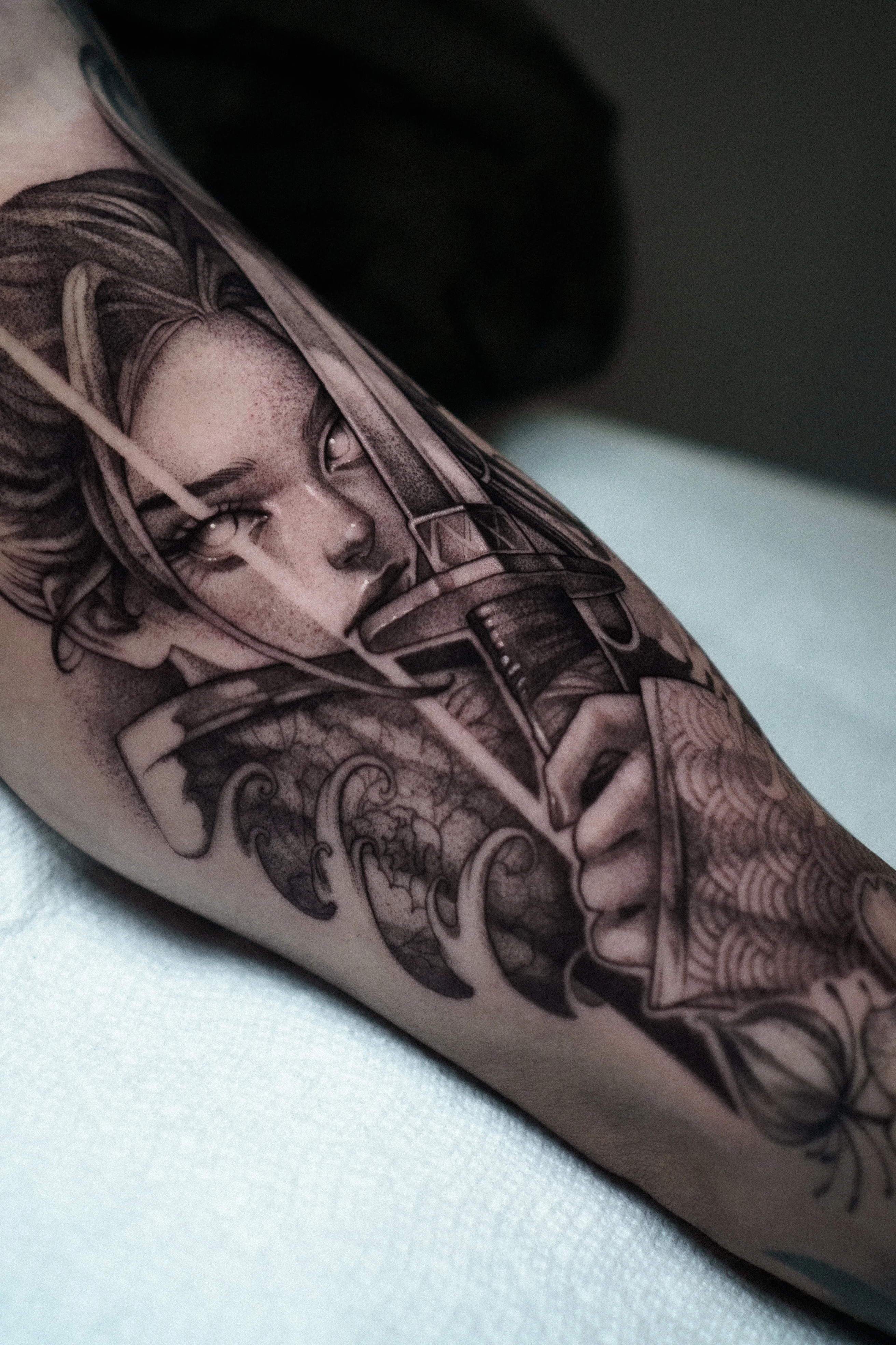 Black & Gray Realism tattoo by Olga Leonova: woman, bow, arrow, waves