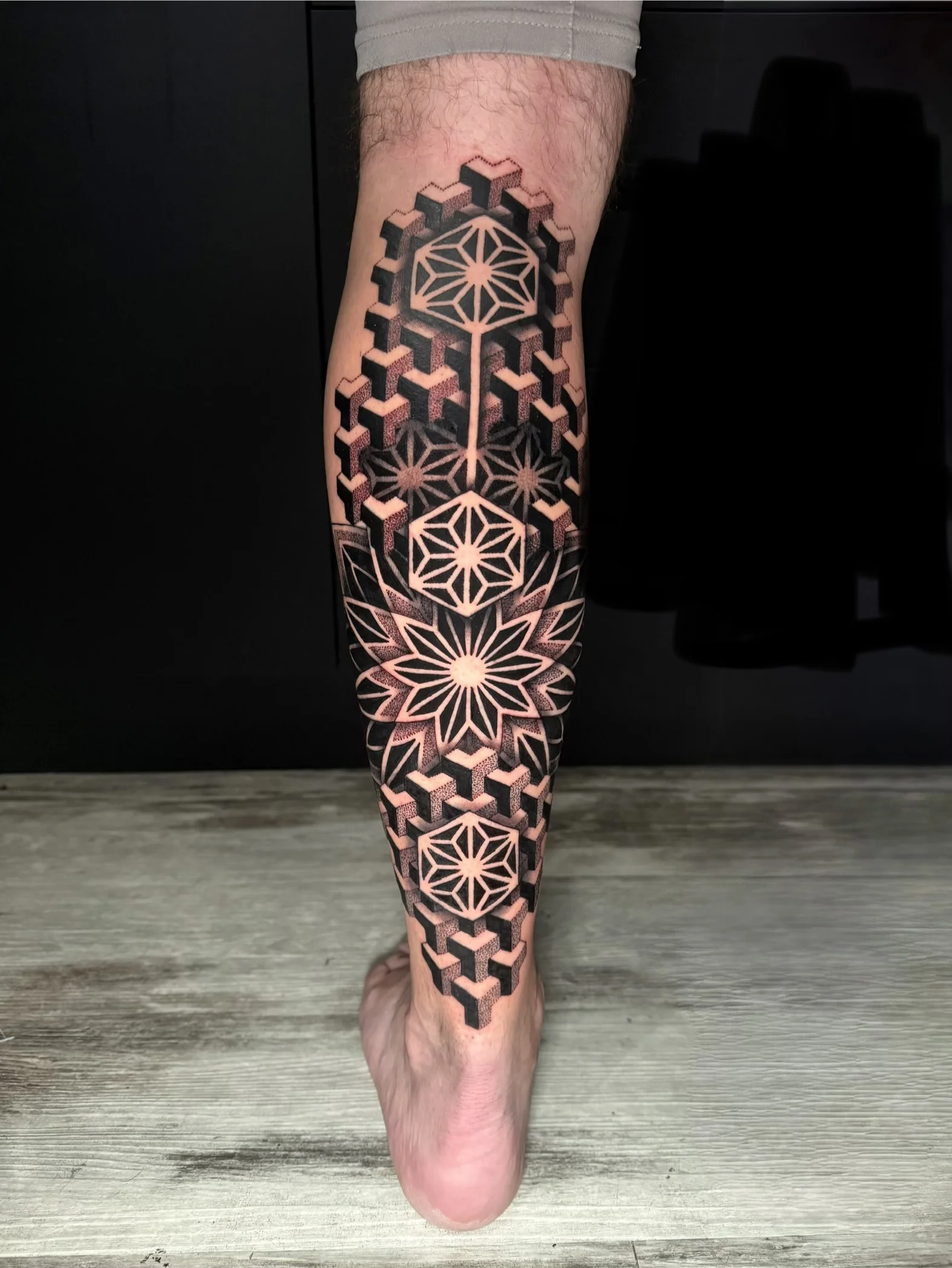 Geometric tattoo by Crystal Alexandria: geometric shapes, hexagons, stars, flower-like pattern