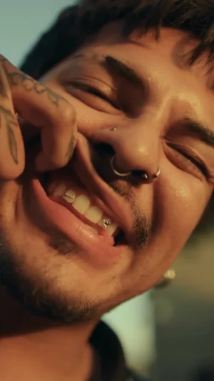Man's Hand and Face Piercings