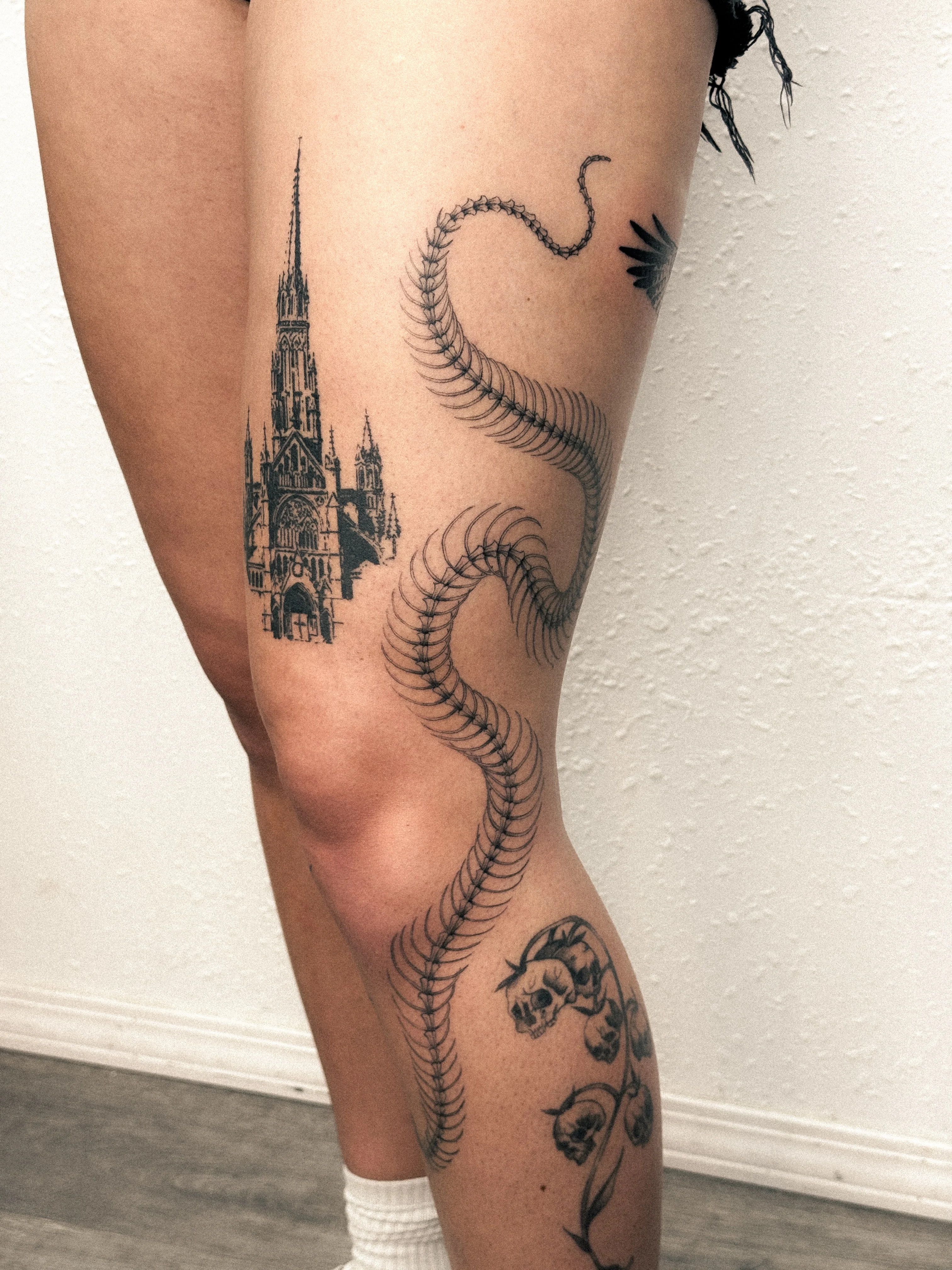 Black & Gray Realism tattoo by Shifu Blue: cathedral, serpent, skull, bellflower