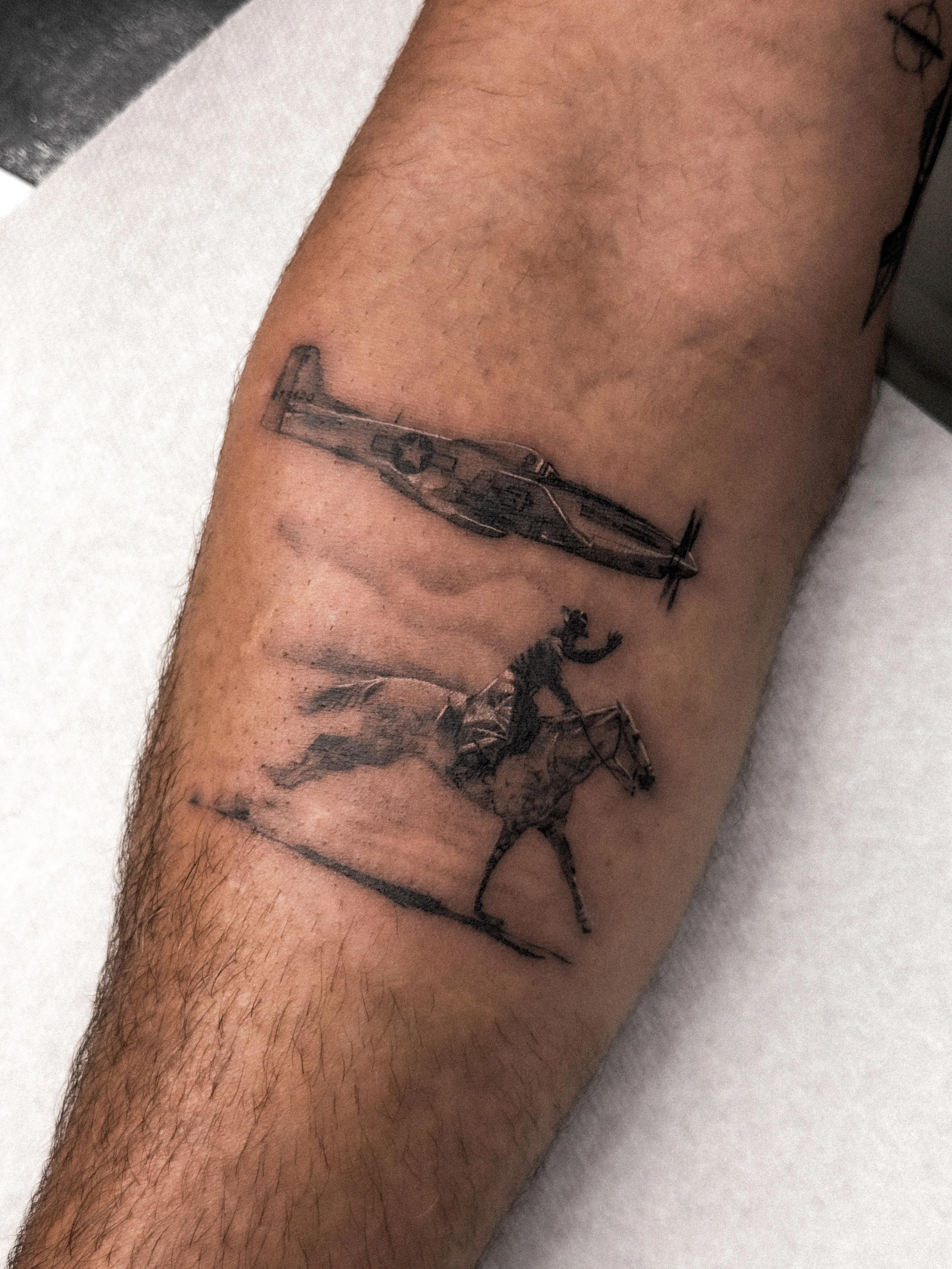 Black & Gray Realism tattoo by Shifu Blue: airplane, horse, cowboy, rider