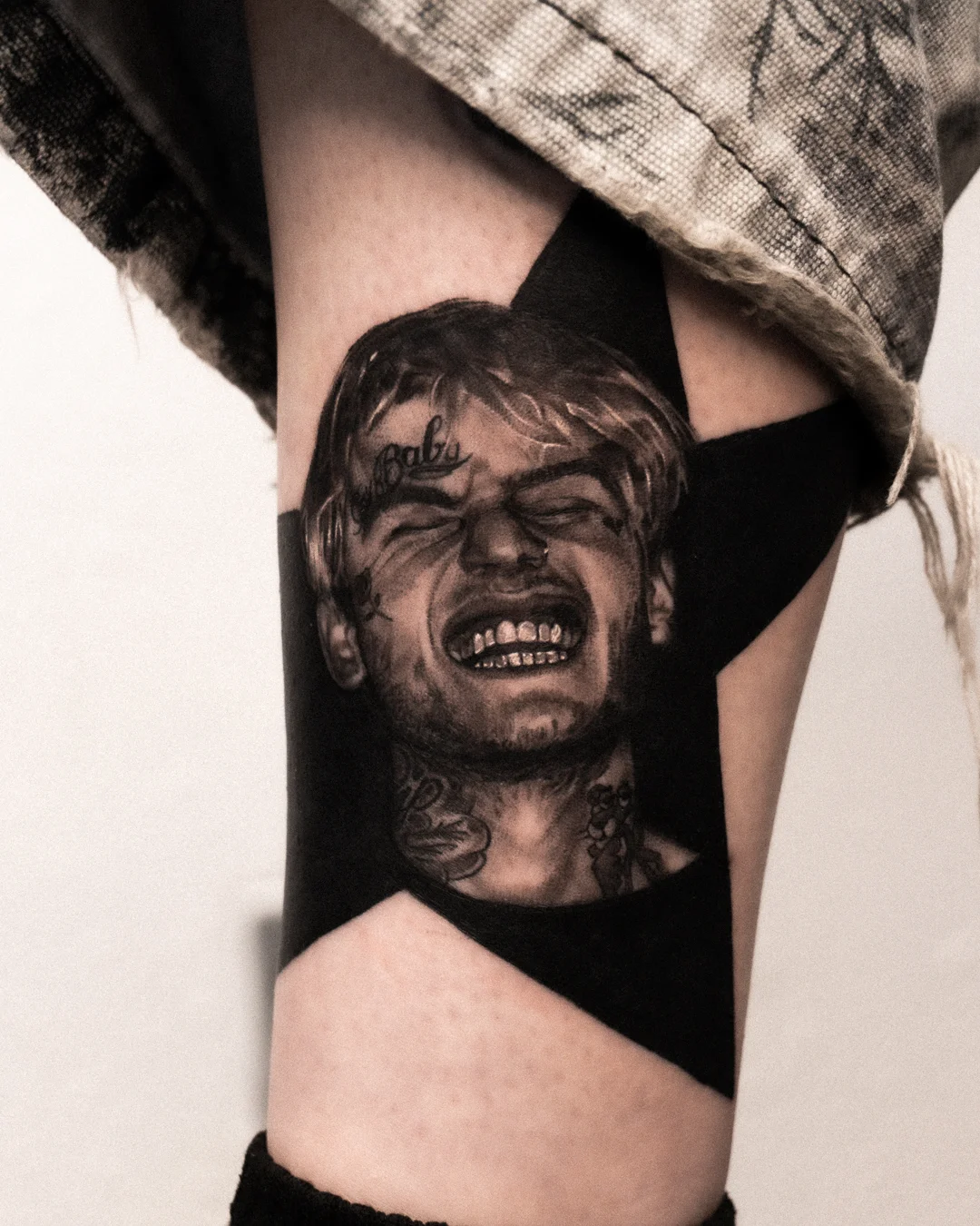 Black & Gray Realism tattoo by Shifu Blue: portrait, male face, smiling mouth, teeth