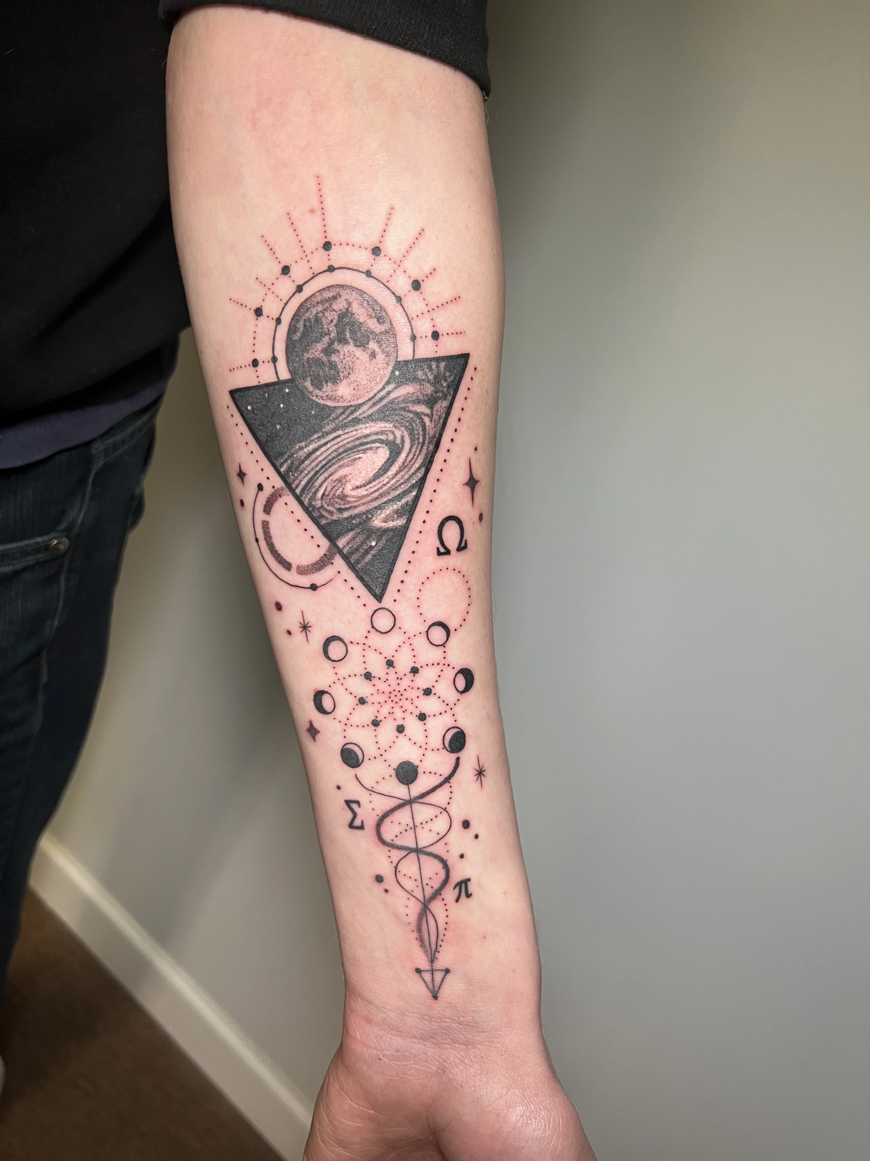 Geometric tattoo by Erin Manning: moon, galaxy, triangle, circles