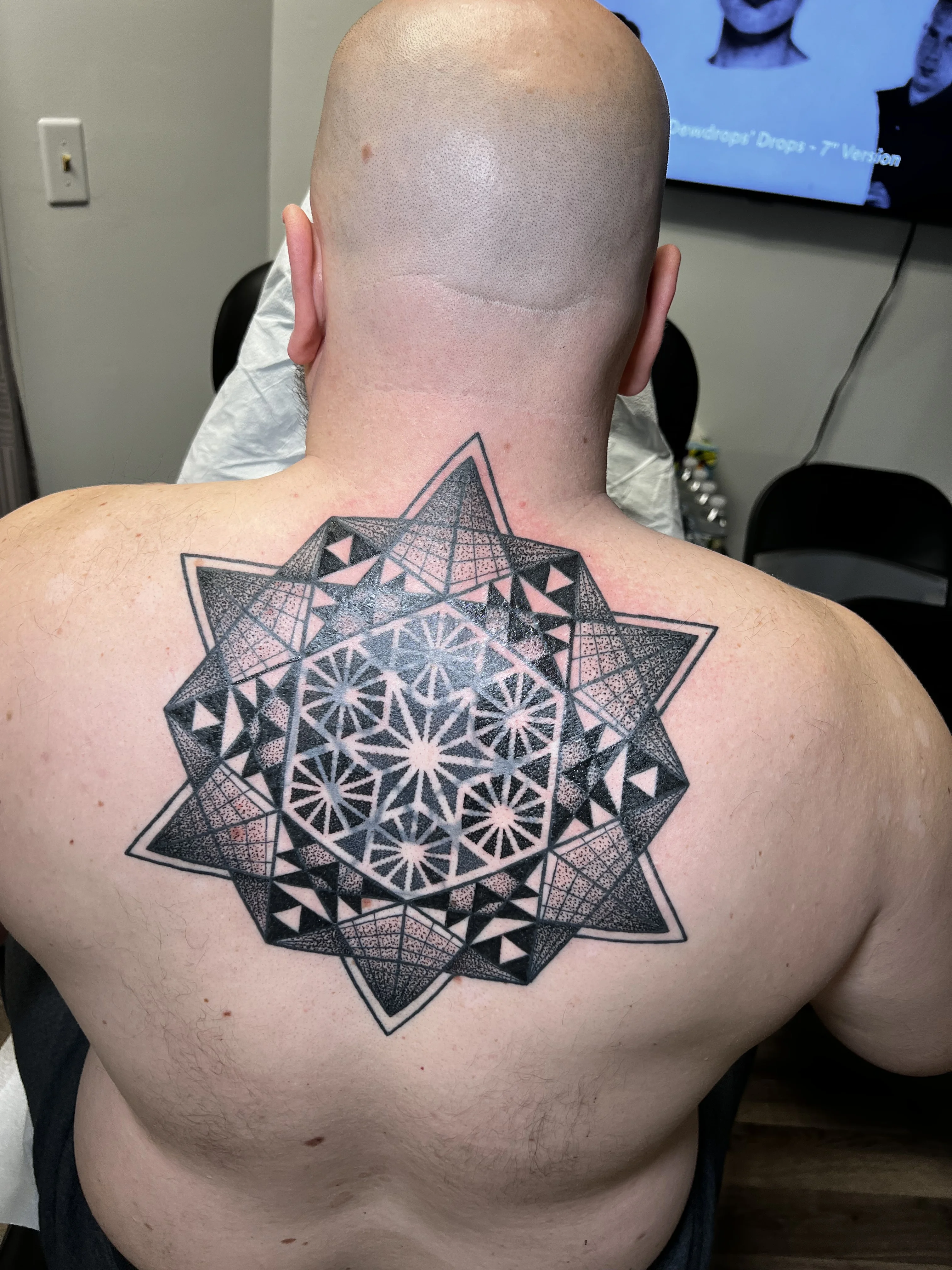 Geometric tattoo by Erin Manning
