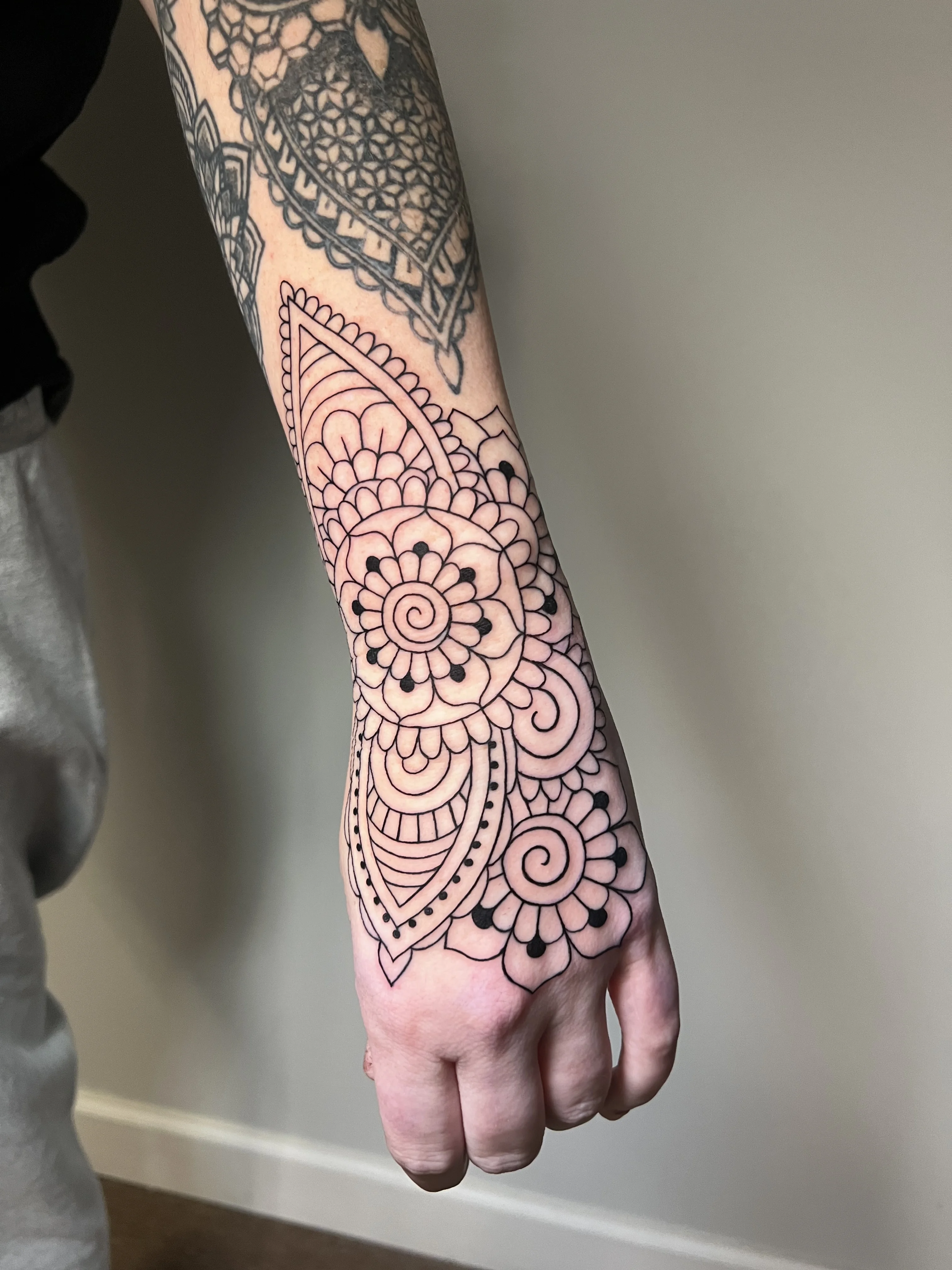Fine Line tattoo by Erin Manning: mandala, flower, spiral, floral