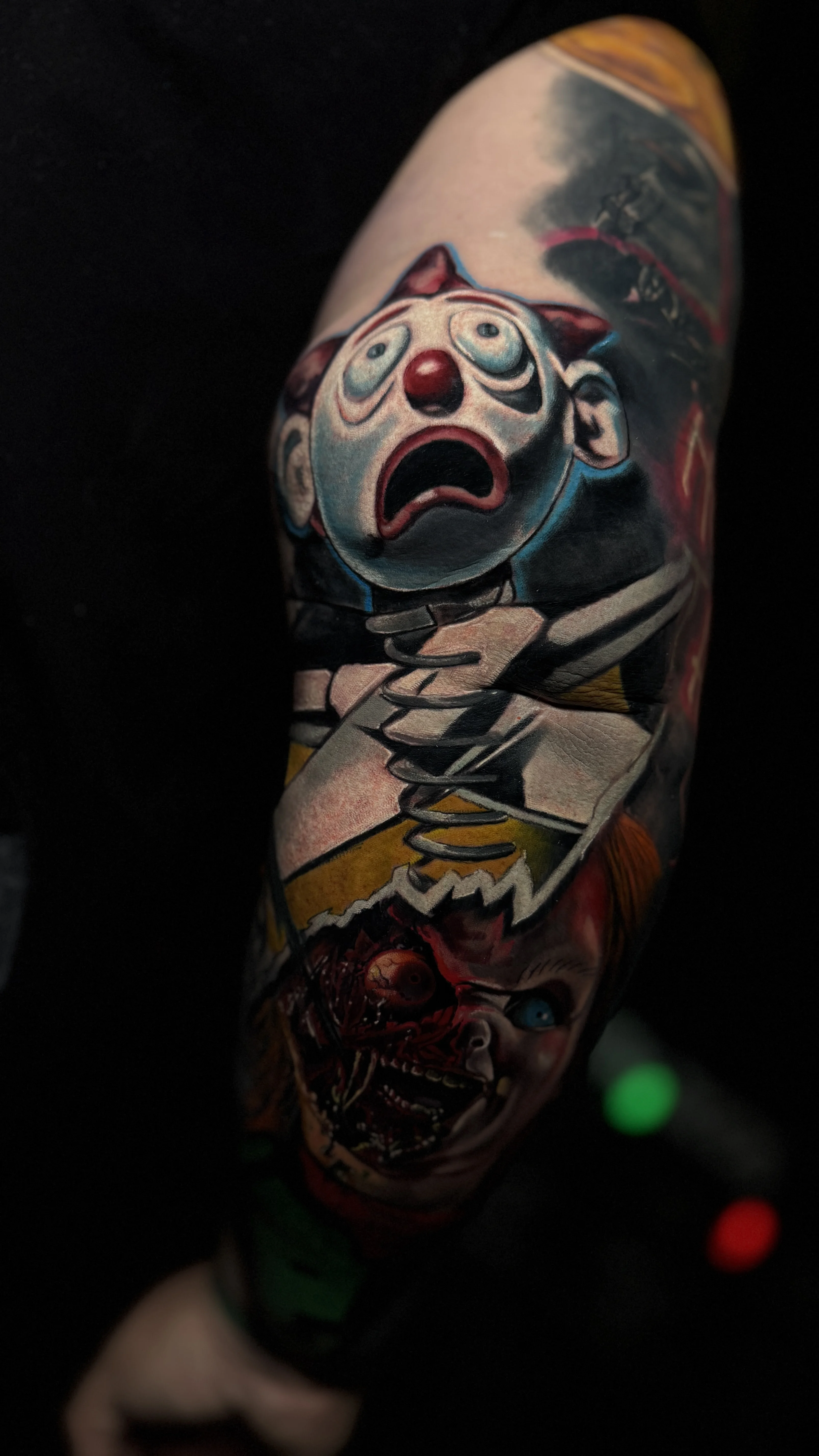 New School tattoo by Pierre Bustos: clown face, spring toy clown, creepy clown, broken doll