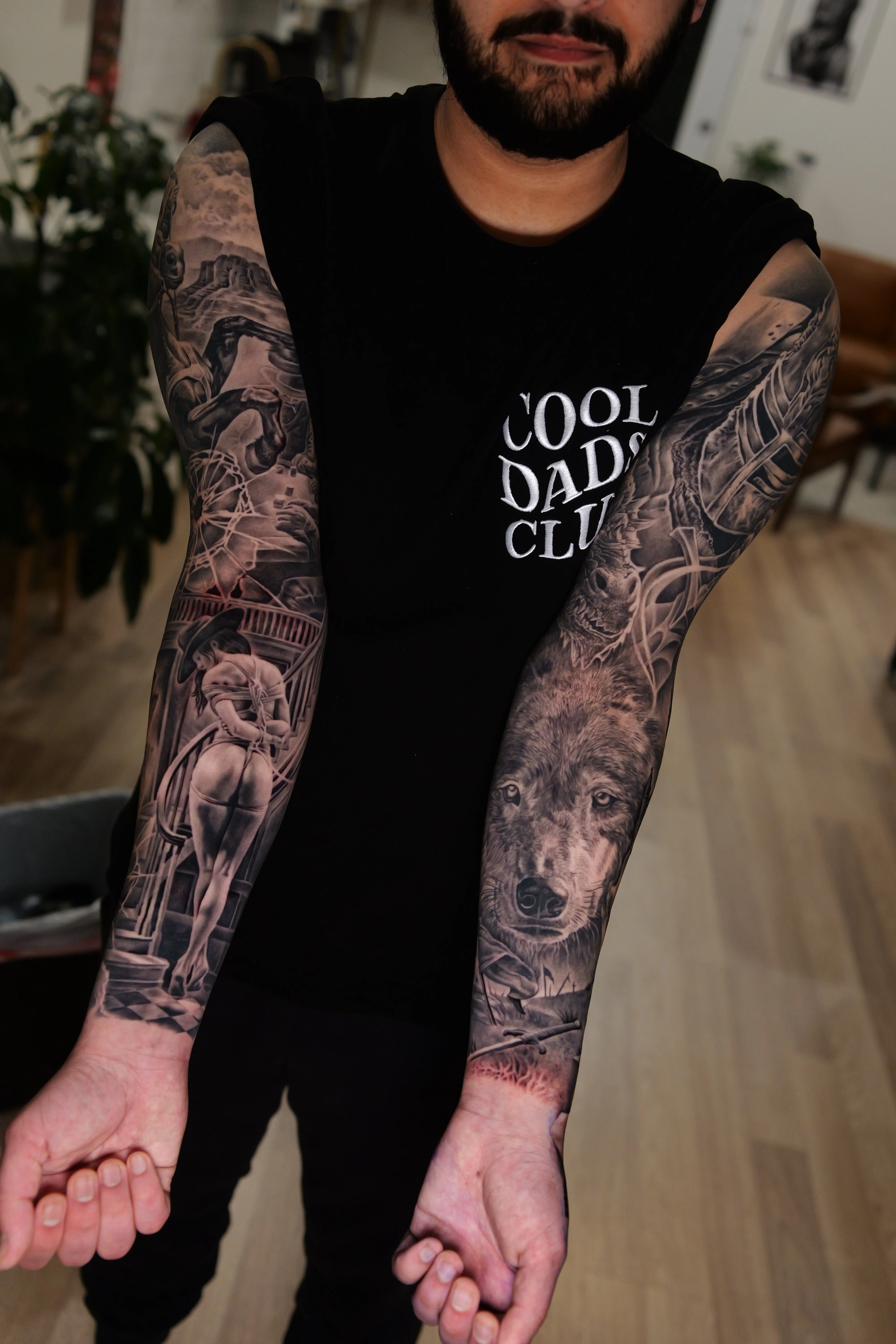 Black & Gray Realism tattoo by Ezra Currier: wolf, woman, bridge, building
