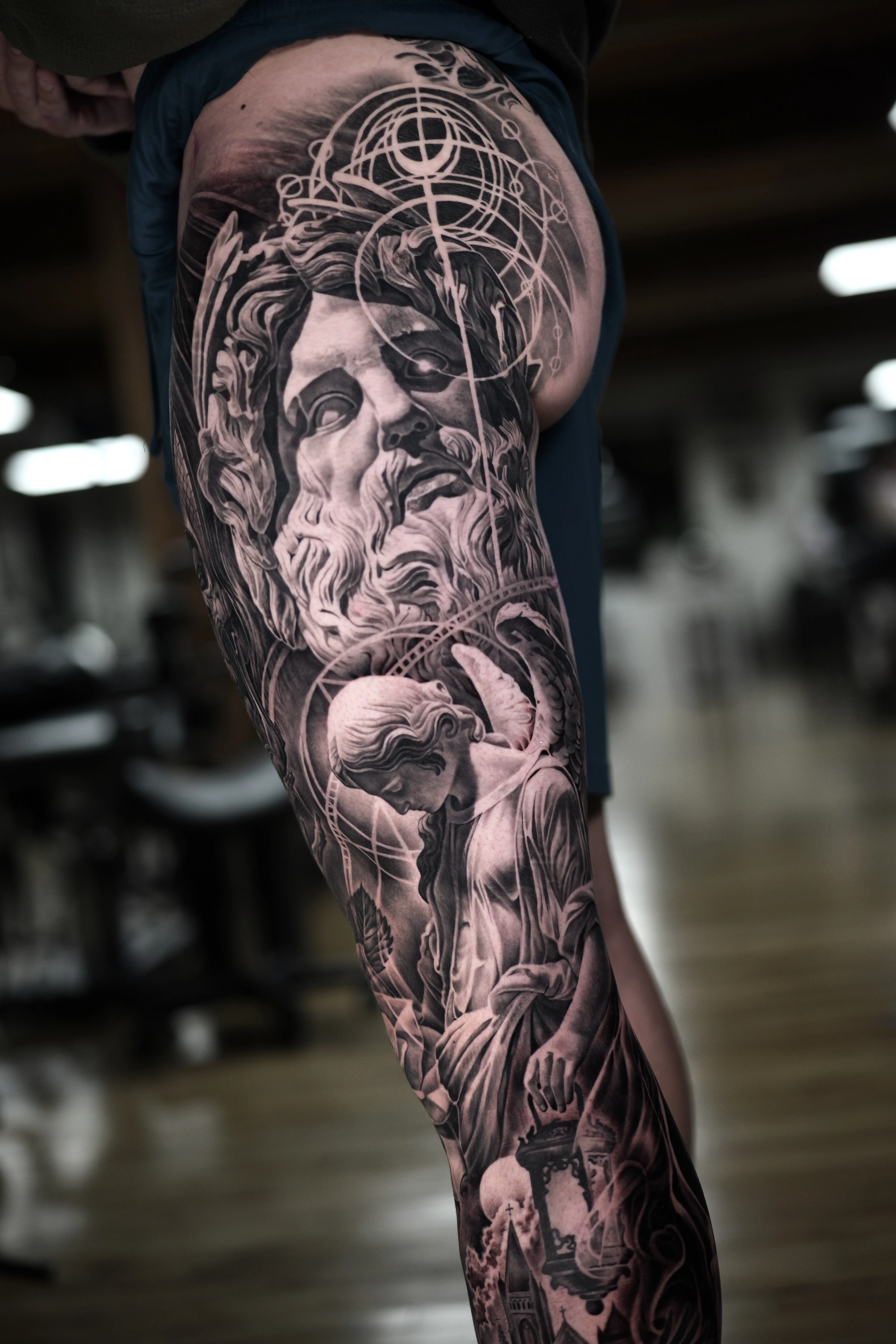 Mythological Black & Grey Full Leg: ancient statue head, bearded man face, angel, draped cloth, lantern, mythology
