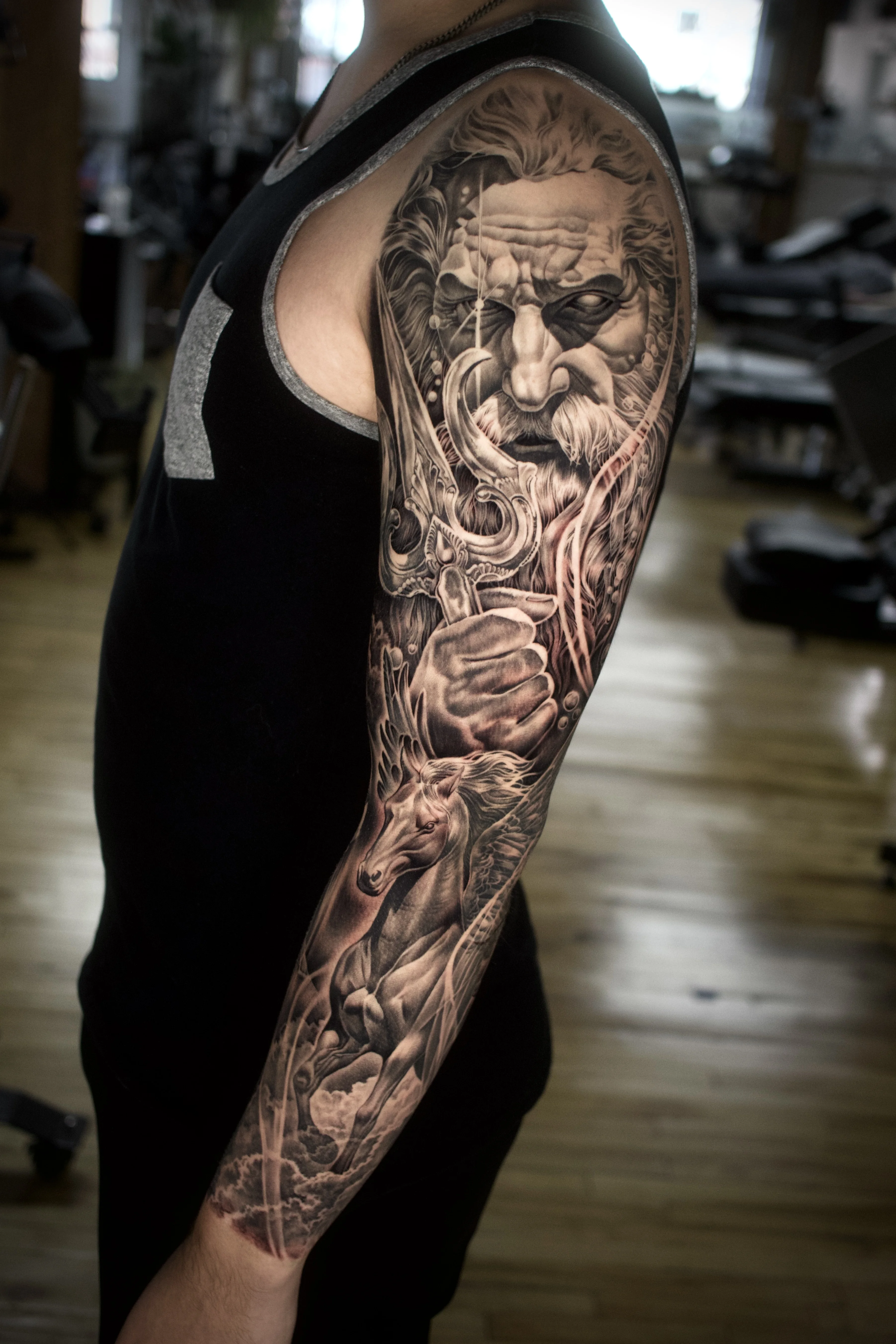 Black & Gray Realism tattoo by Ezra Currier: old man face, horse, smoking pipe, hand