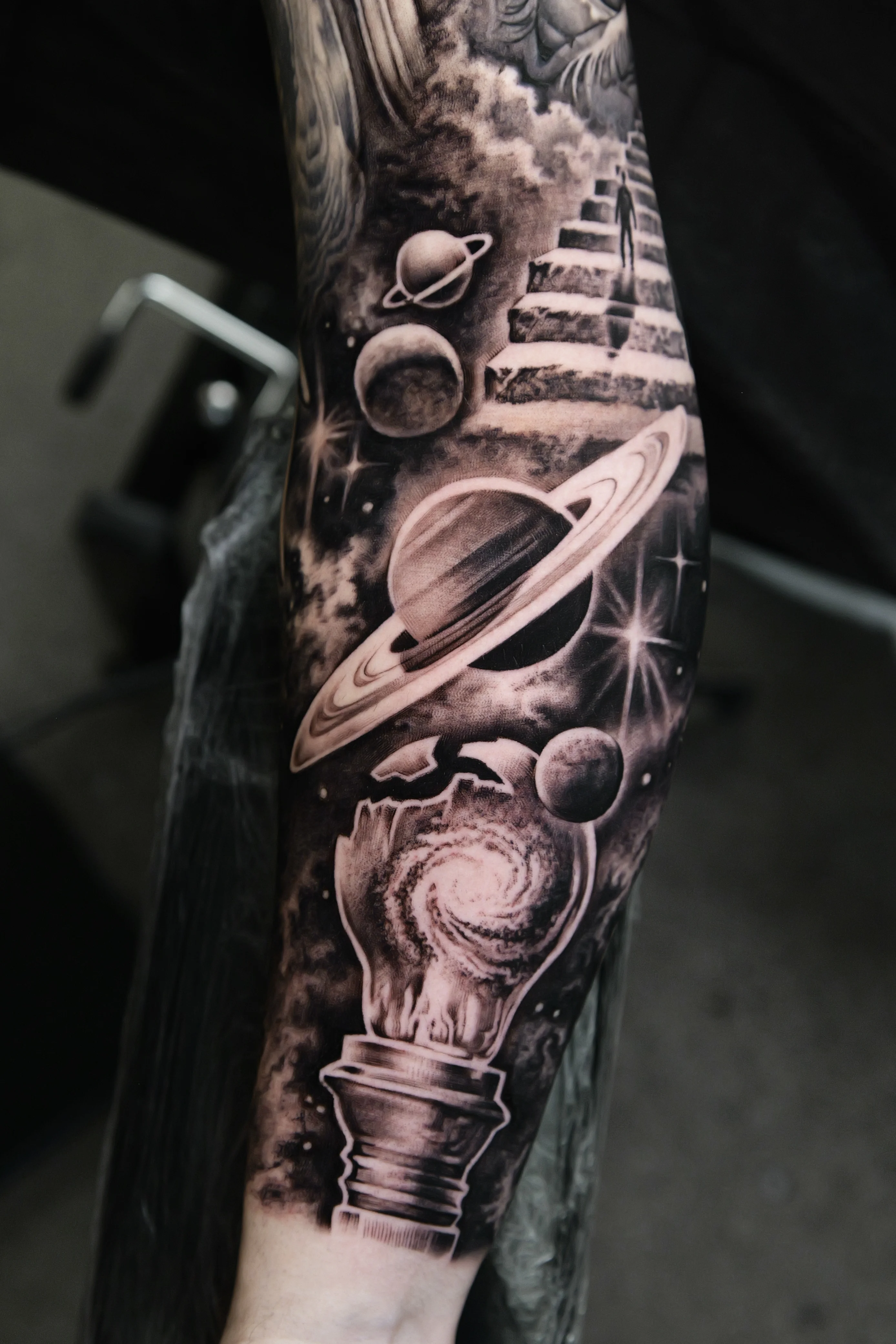 Black & Gray Realism tattoo by Ezra Currier: saturn, planets, space, light bulb