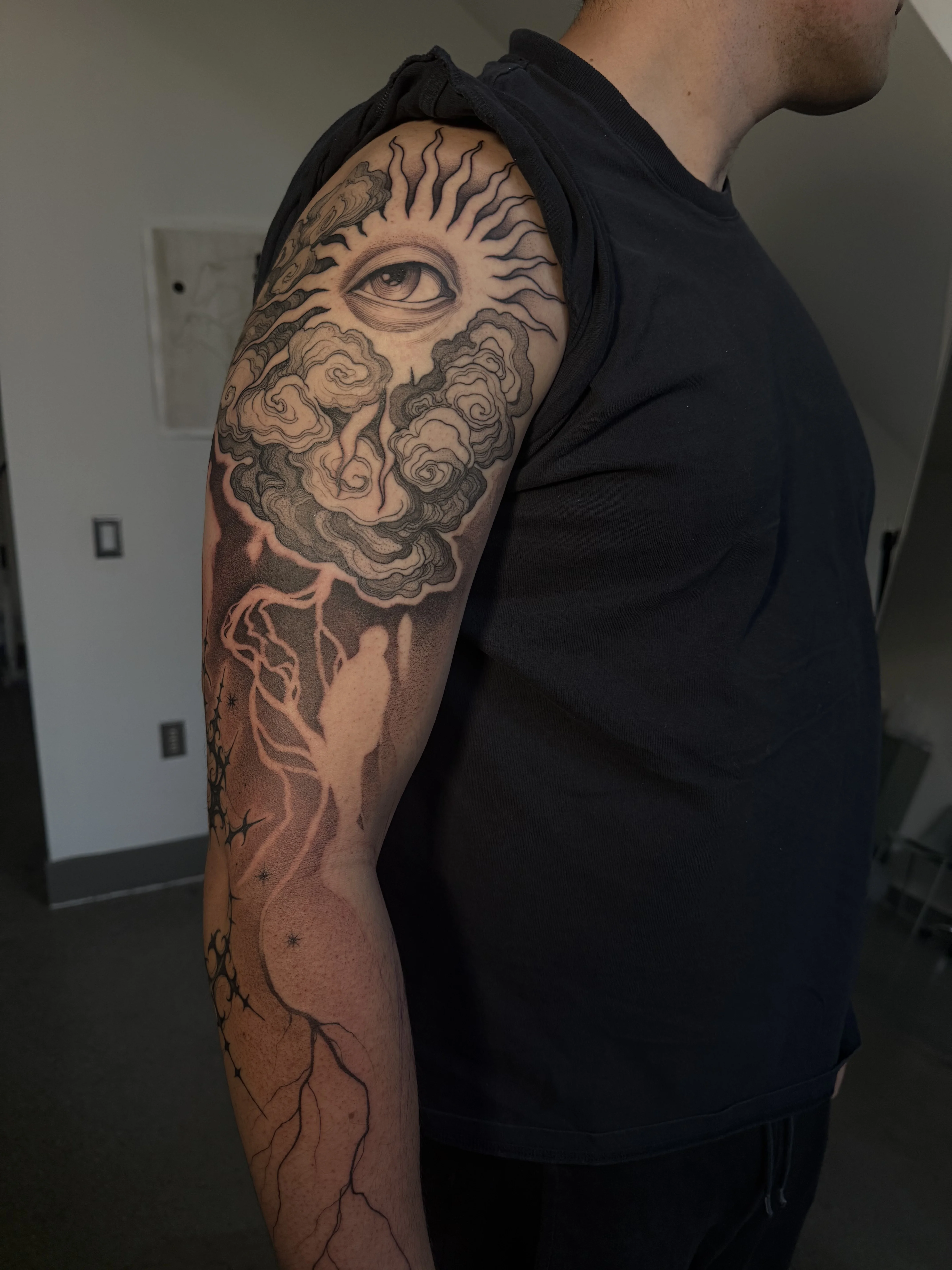 Black & Gray Realism tattoo by Konstantin Strokin: eye, sun, clouds, lightning