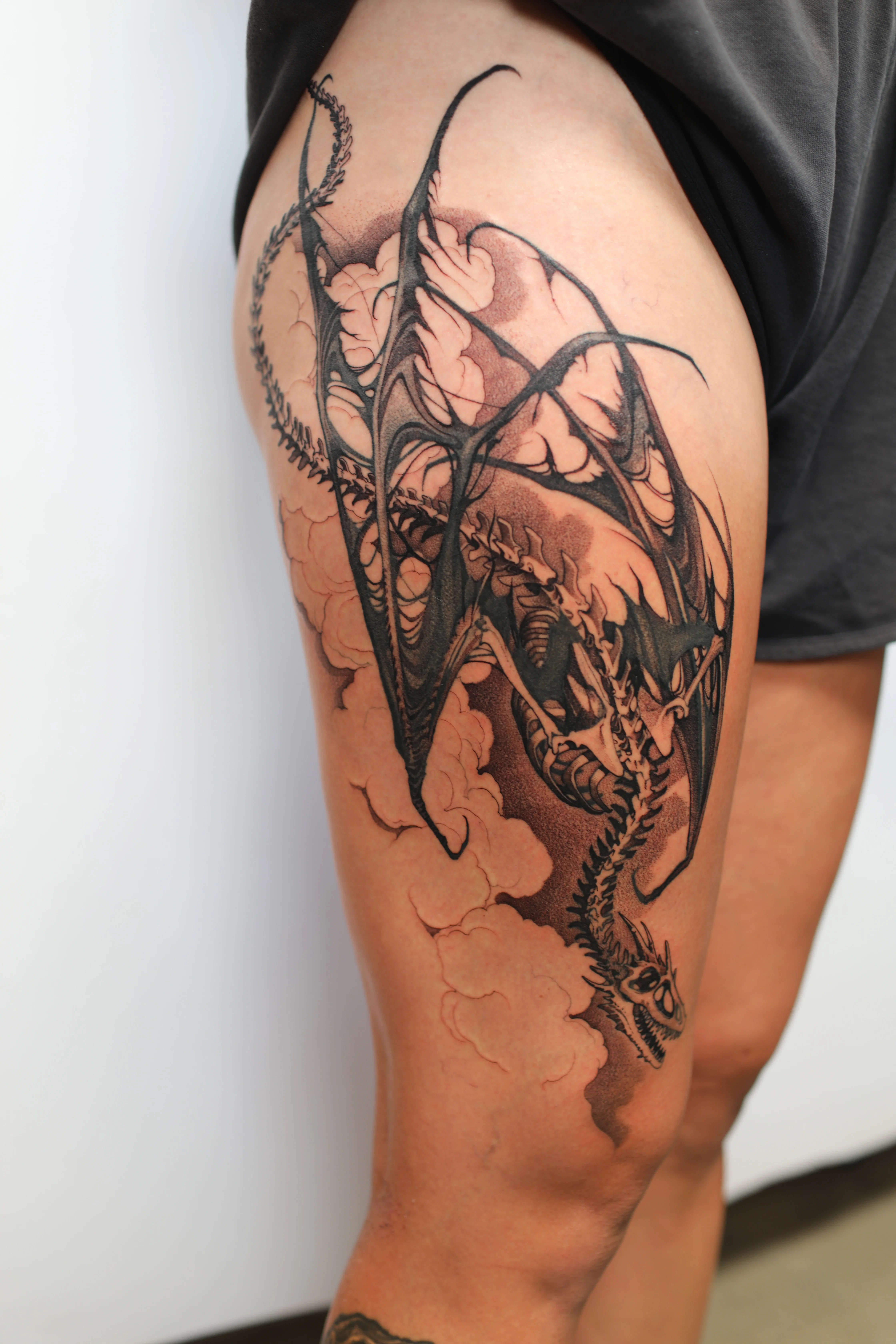 Blackwork Dragon Thigh Piece: dragon, clouds, wings, tail, mythology, fantasy