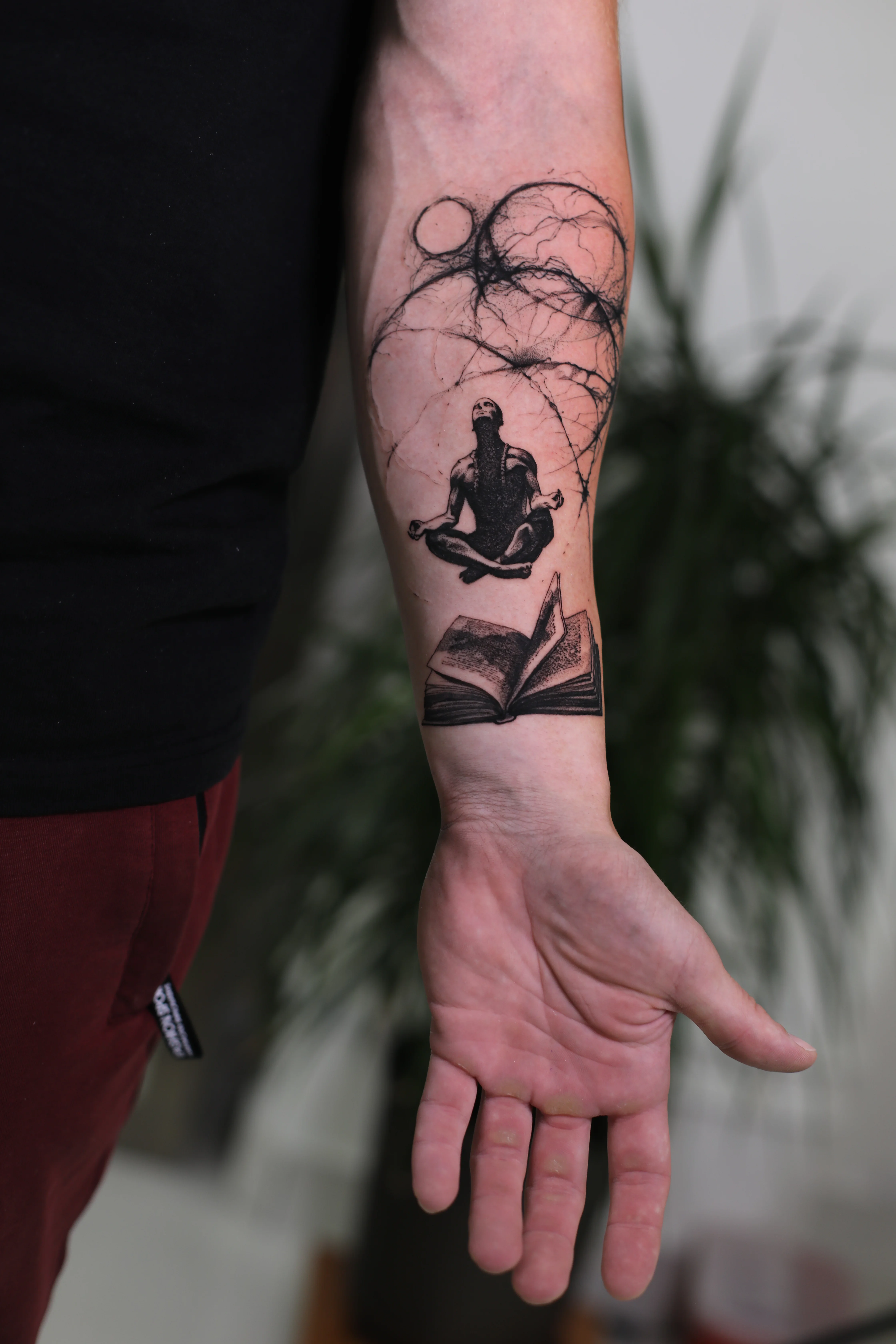 Meditating Man and Book Forearm: meditating man, open book, abstract circles, spiritual, mystical, meditation